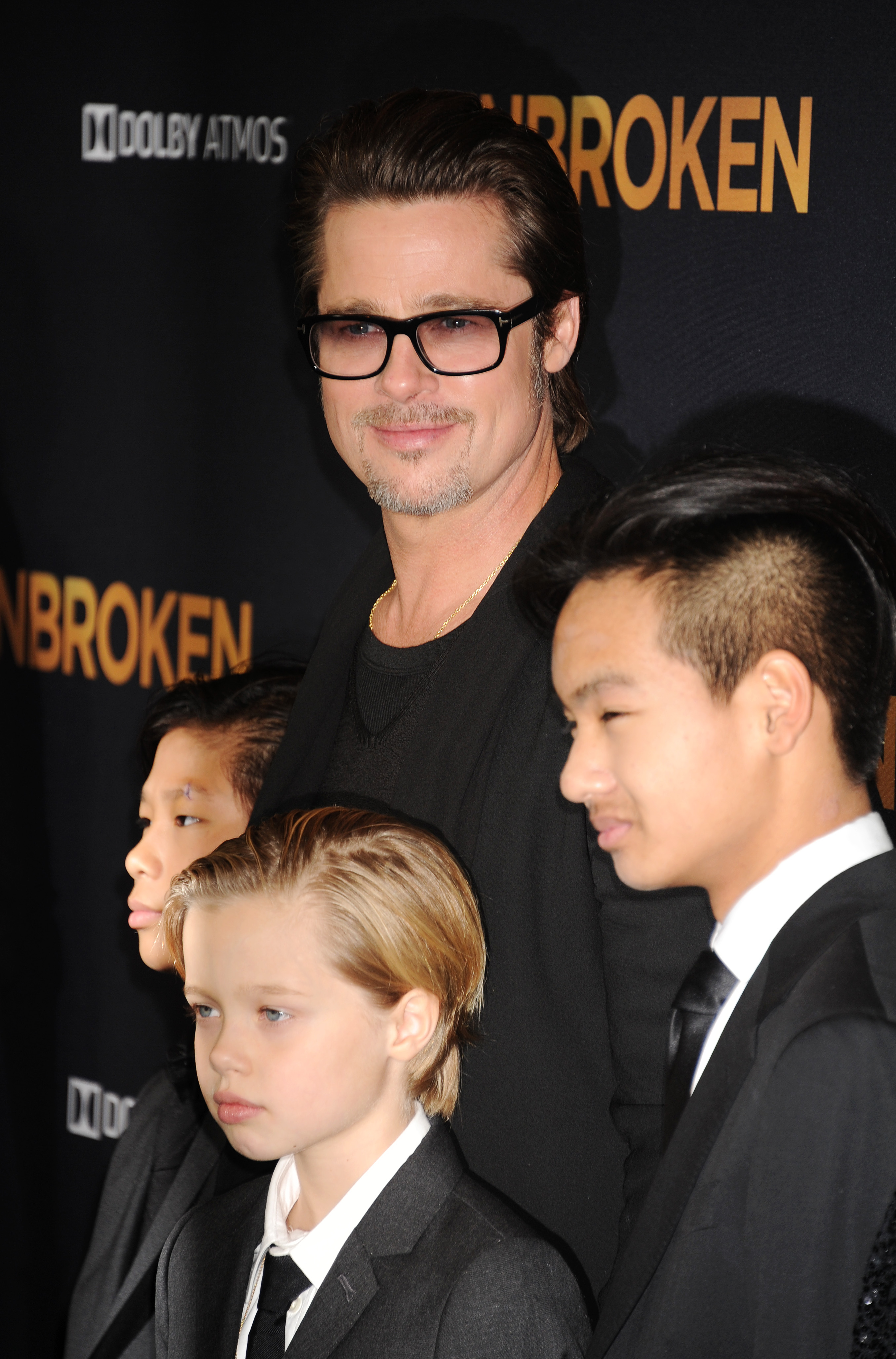 HOLLYWOOD, CA - DECEMBER 15: Actor Brad Pitt, Pax Thien Jolie-Pitt, Shiloh Nouvel Jolie-Pitt and Maddox Jolie-Pitt attend the