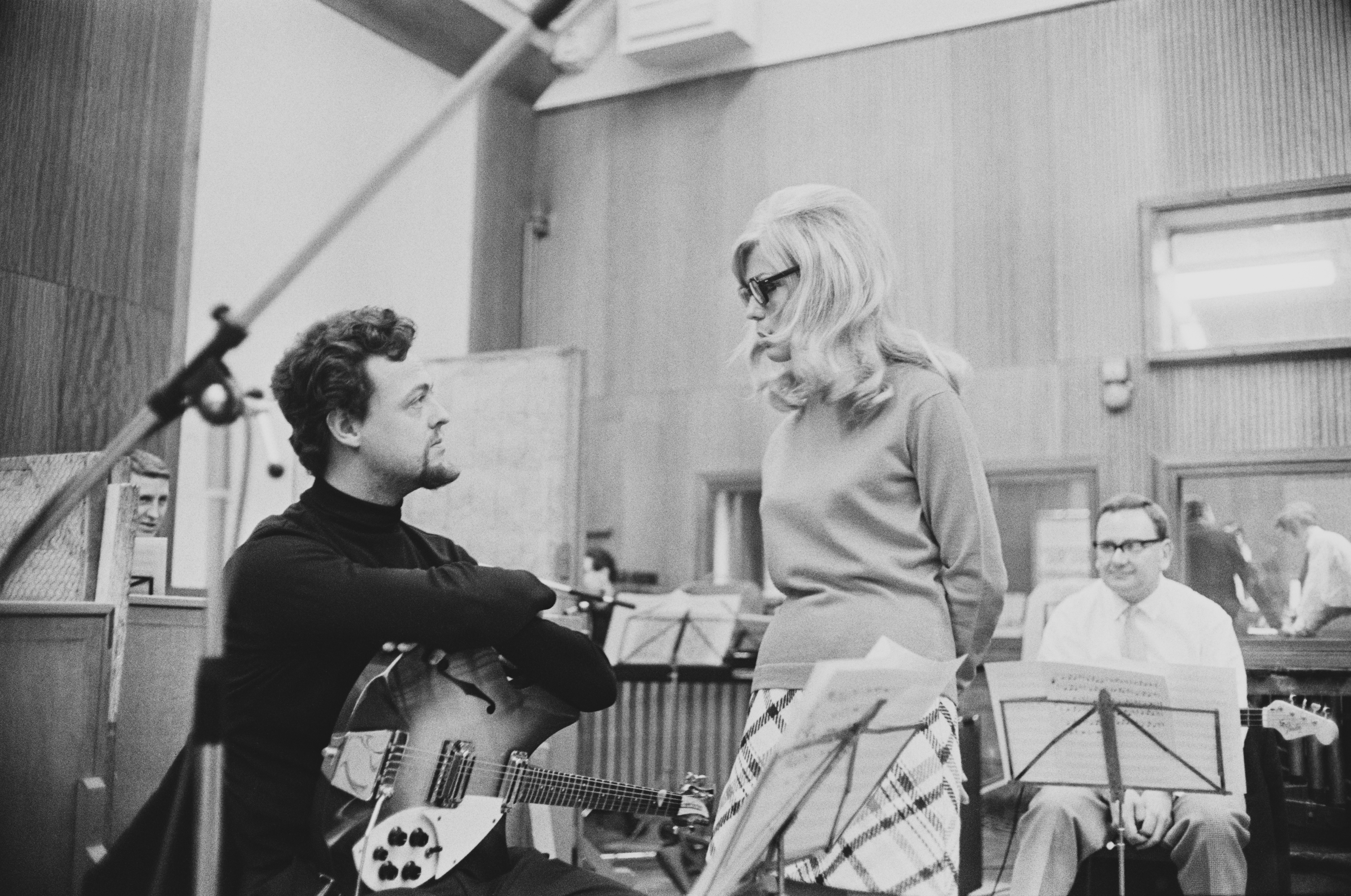English musician Big Jim Sullivan (1941 - 2012) and American singer and actress Nancy Sinatra in a recording studio, 1967. (Photo by Harry Dempster/Express/Hulton Archive/Getty Images)