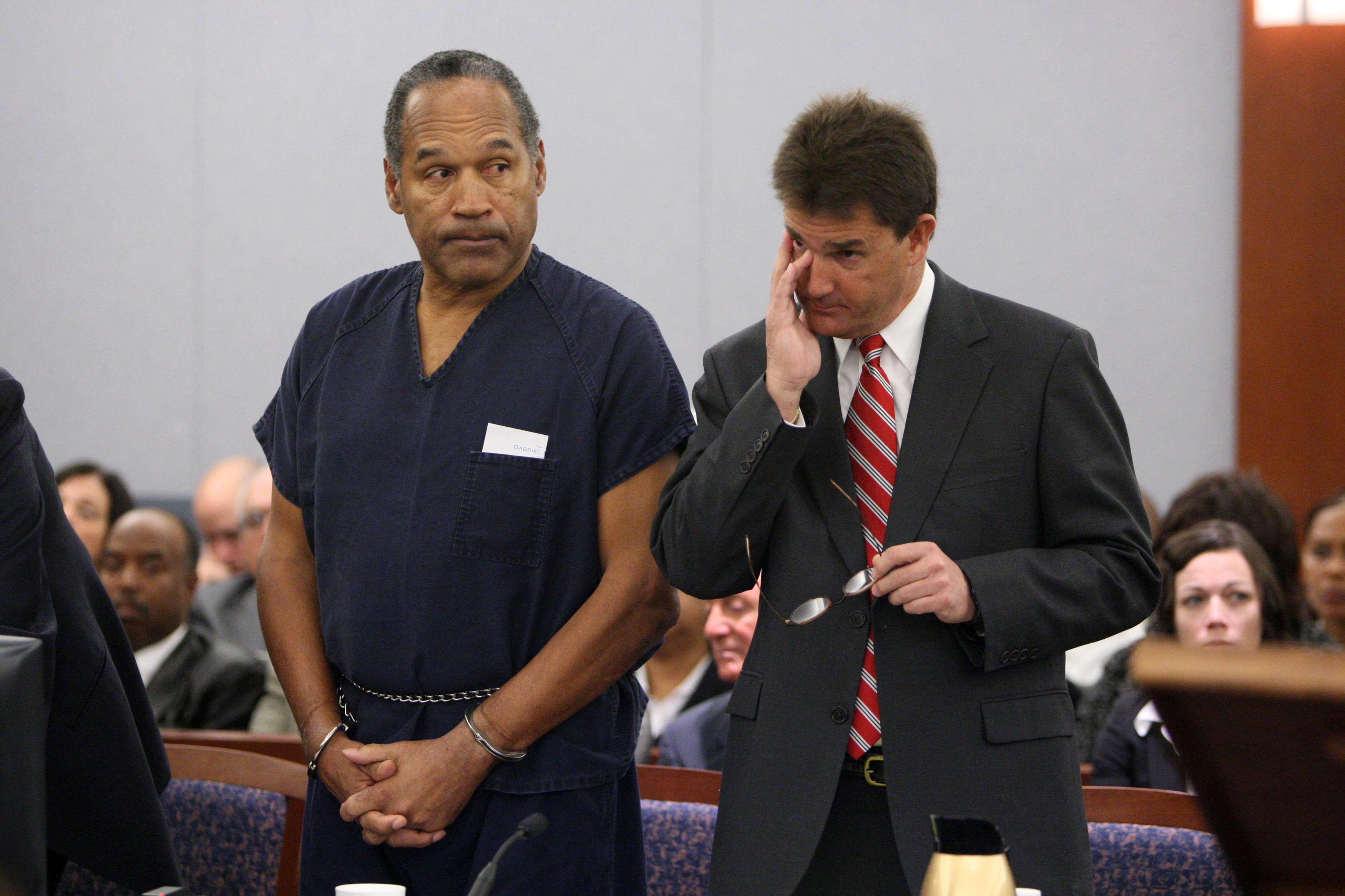 LAS VEGAS - DECEMBER 5:  O.J. Simpson (L) stands in court with attorney Yale Galanter during his sentencing at the Clark County Regional Justice Center December 5, 2008 in Las Vegas, Nevada.  Simpson and co-defendant Clarence 