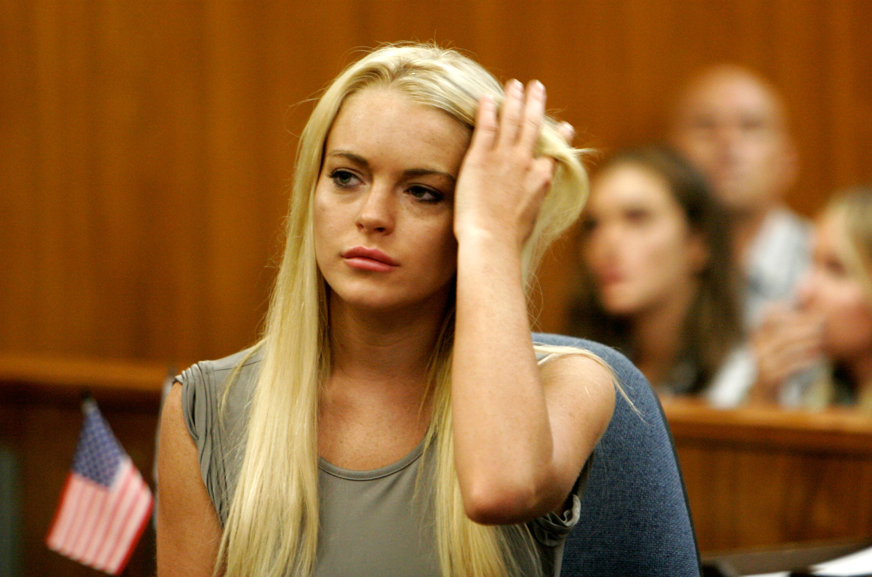 BEVERLY HILLS, CA - JULY 20:  Actress Lindsay Lohan surrenders at the Beverly Hills Courthouse to serve her 90 day jail sentence on July 20, 2010 in Beverly Hills, California. Lindsay Lohan was found in violation of her probation for the August 2007 no-contest plea to drug and alcohol charges stemming from two separate traffic accidents.  (Photo by Al Seib-Pool/Getty Images)