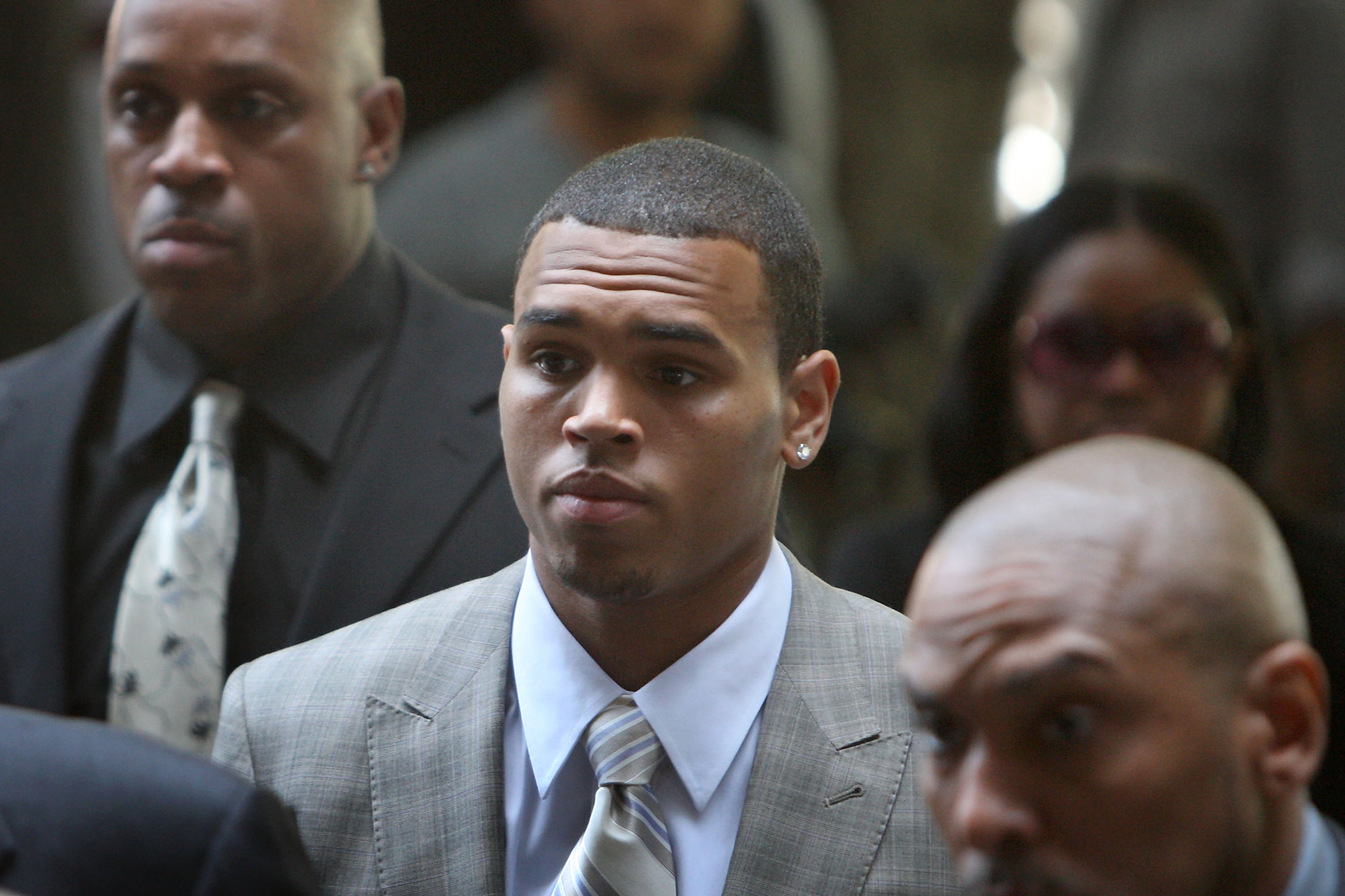 LOS ANGELES, CA - JUNE 22:  Singer Chris Brown arrives to the Criminal Courts Building for a preliminary hearing to determine if he will stand trial for allegedly attacking pop singer Rihanna on June 23, 2009 in Los Angeles, California. Brown is accused of assaulting and threatening his then-girlfriend, Rihanna, during an argument in a rented Lamborghini sports car following a pre-Grammy Awards party on February 8. The singer is currently free on $50,000 bail.  (Photo by David McNew/Getty Images)