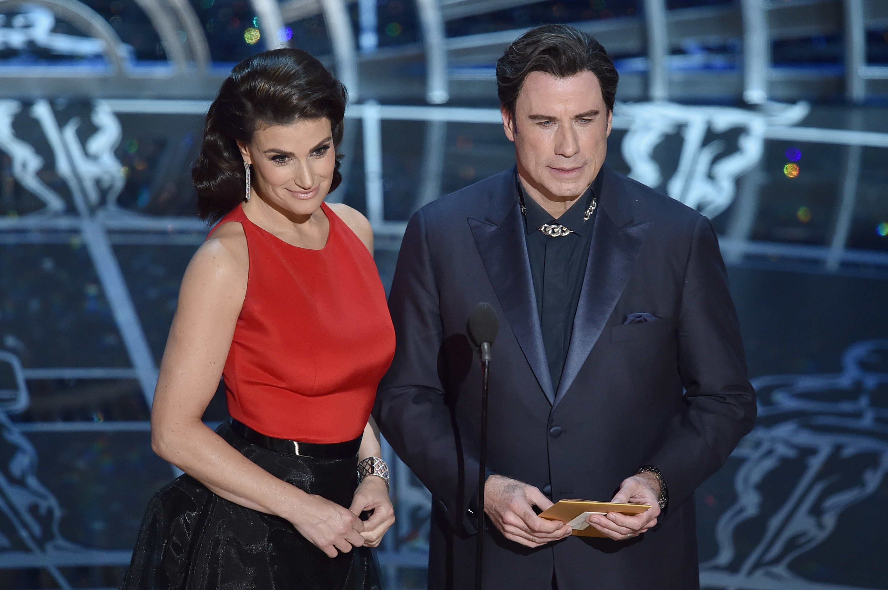HOLLYWOOD, CA - FEBRUARY 22:  Actress Idina Menzel and actor John Travolta speak onstage during the 87th Annual Academy Awards at Dolby Theatre on February 22, 2015 in Hollywood, California.  (Photo by Kevin Winter/Getty Images)