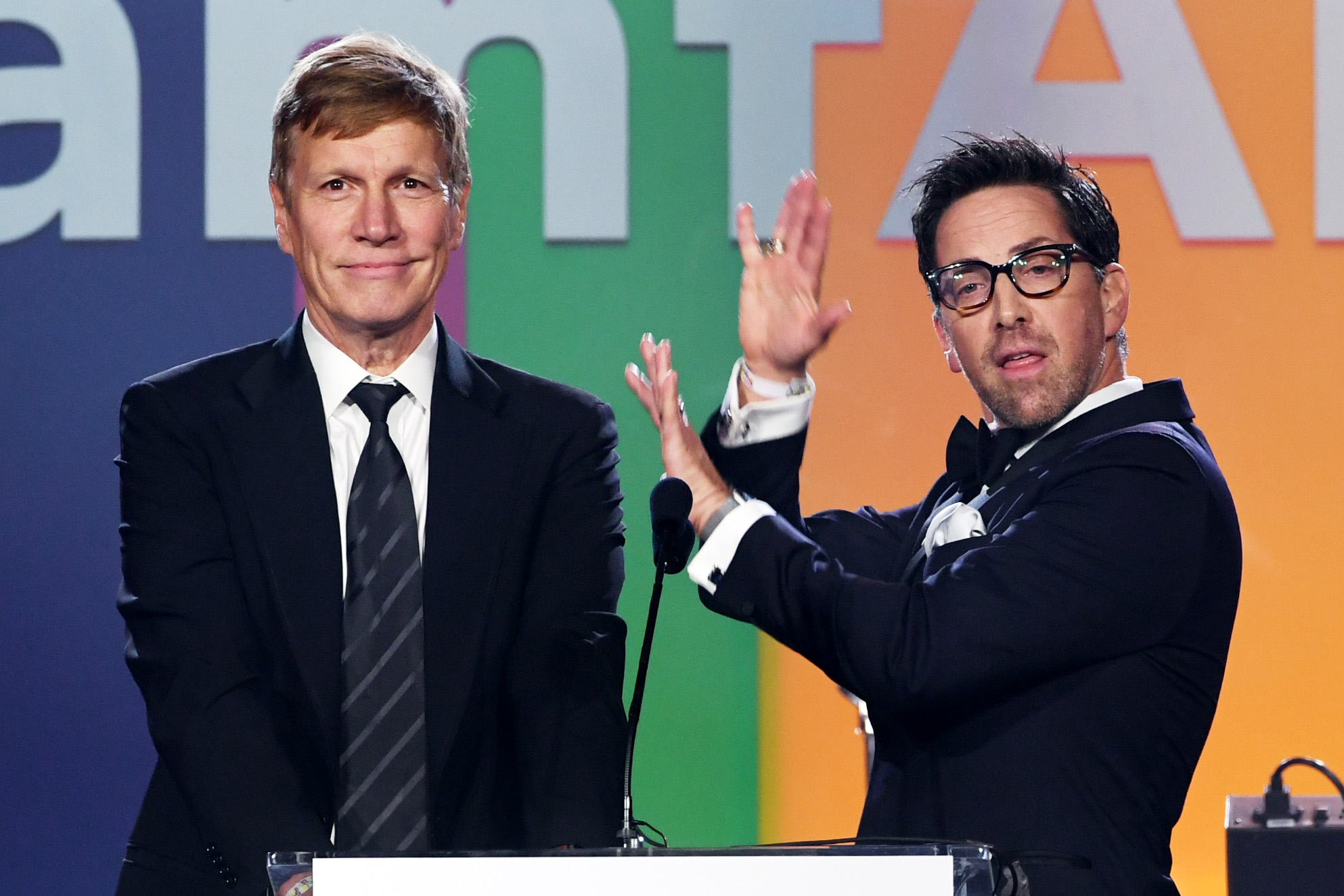 LOS ANGELES, CALIFORNIA - OCTOBER 10: (L-R) Don Roos and Dan Bucatinsky speak onstage during the 2019 amfAR Gala Los Angeles at Milk Studios on October 10, 2019 in Los Angeles, California. (Photo by Kevin Winter/amfAR/Getty Images for amfAR)