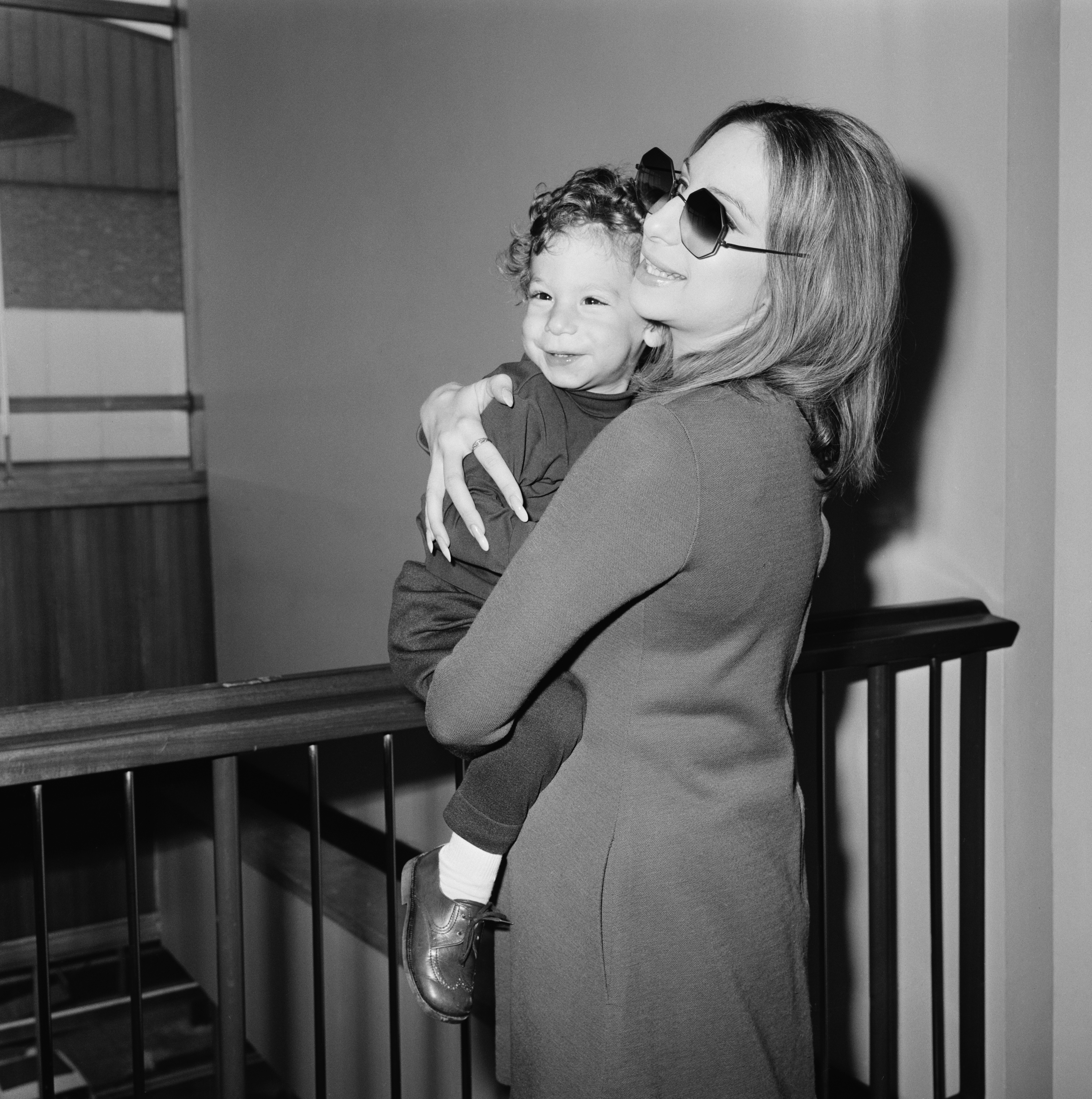 American singer, songwriter, actress, and filmmaker Barbra Streisand with her son Jason Gould at Heathrow Airport, London, UK, 11th April 1969. (Photo by George Stroud/Daily Express/Hulton Archive/Getty Images)