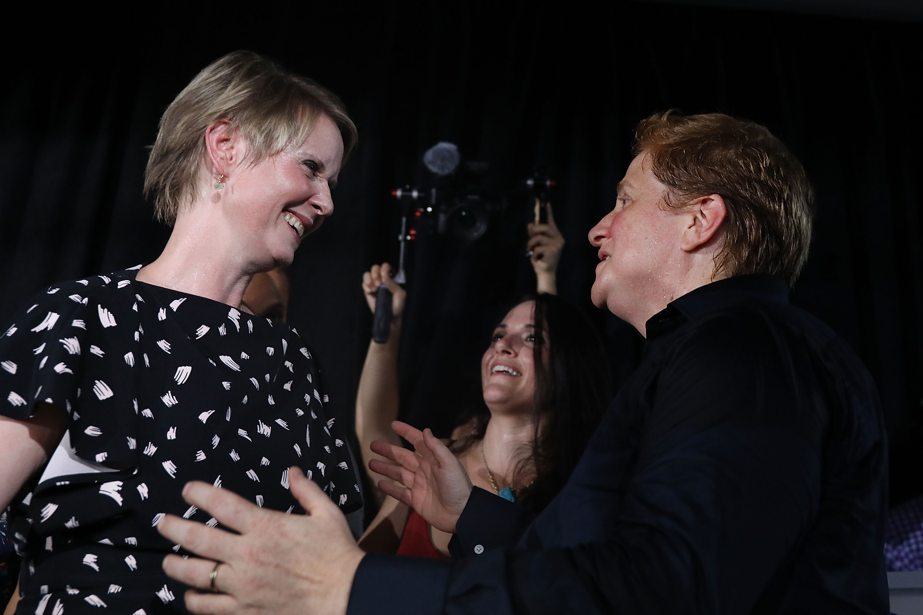 NEW YORK, NY - SEPTEMBER 13: New York Democratic primary candidate for governor Cynthia Nixon speaks with her her wife, Christine Marinoni, after making a concession speech at a Brooklyn restaurant on September 13, 2018 in New York City. In a race where she sought to attract disenfranchised voters and those on the left, the actress and activist was challenging the incumbent governor Andrew Cuomo.  (Photo by Spencer Platt/Getty Images)