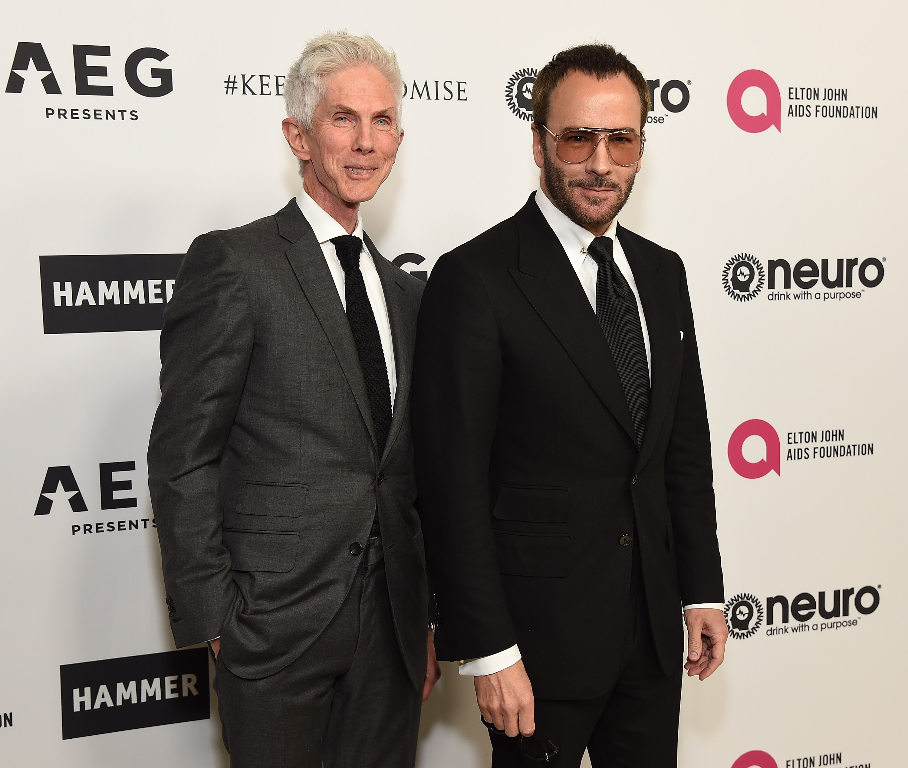 LOS ANGELES, CA - MARCH 25:  Fashion designer Tom Ford (R) and Richard Buckley celebrate Elton John
