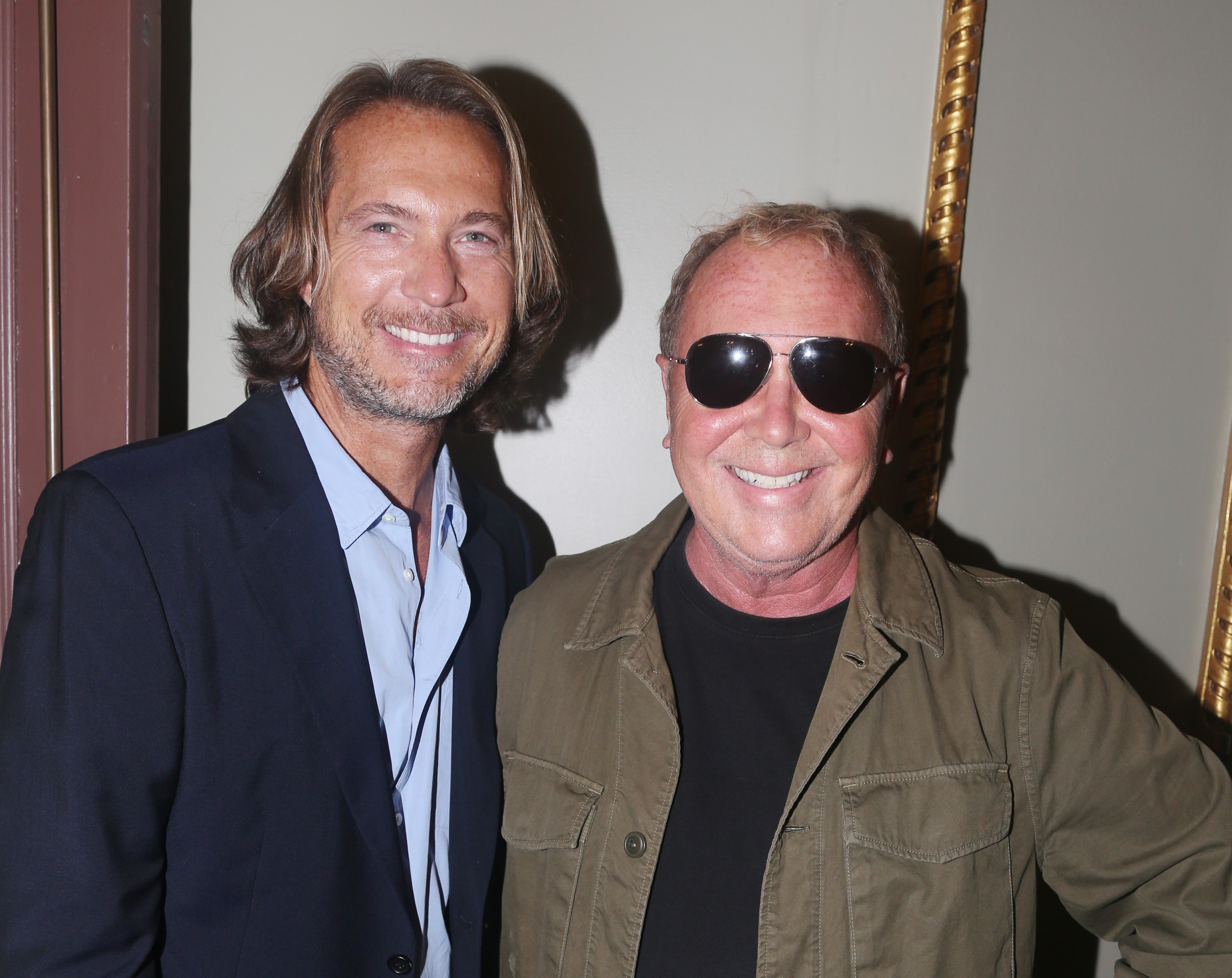 NEW YORK, NEW YORK - OCTOBER 13: Lance Le Pere and Michael Kors pose at the opening night of 