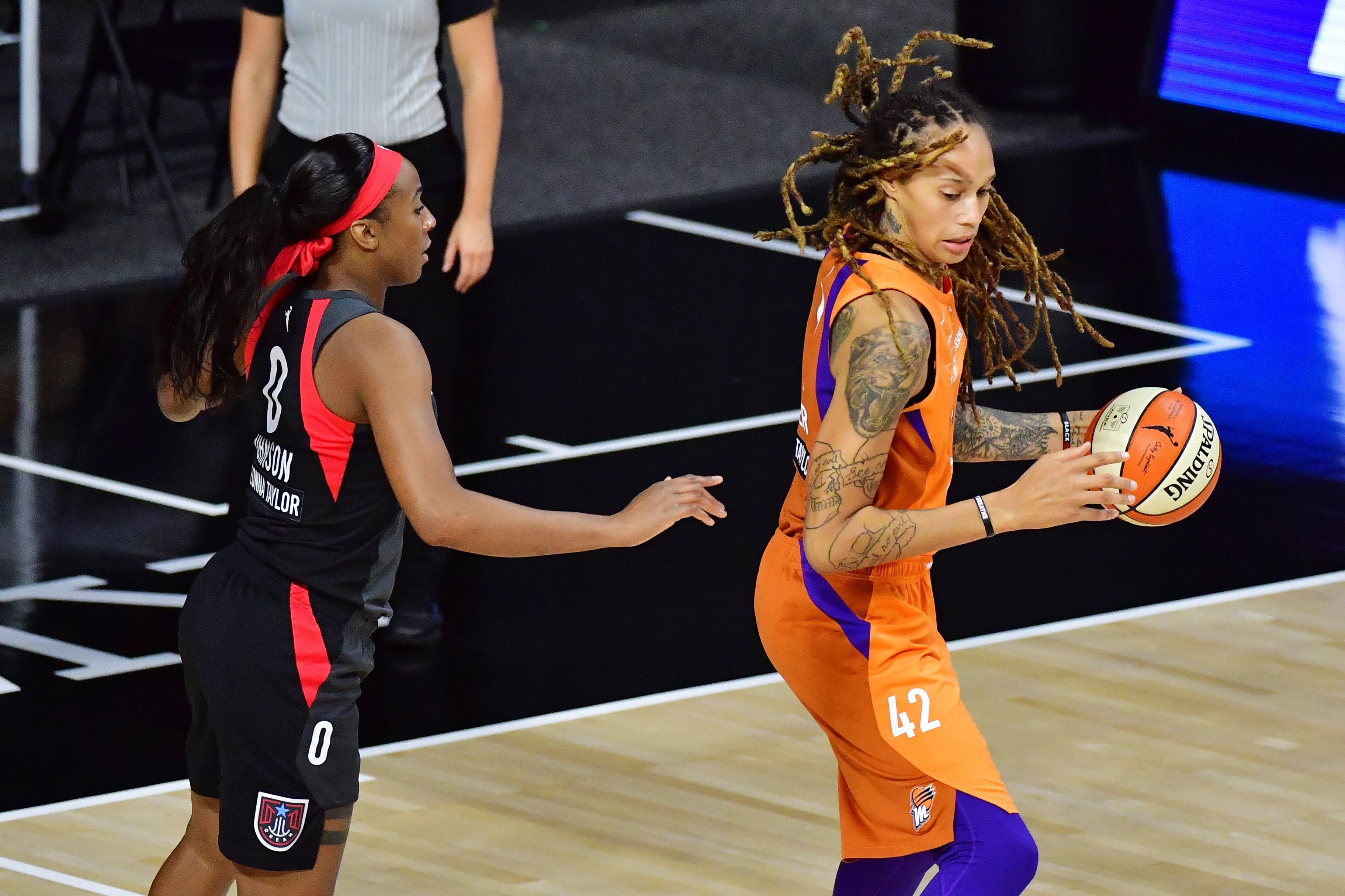 PALMETTO, FLORIDA - AUGUST 14: Brittney Griner #42 of the Phoenix Mercury is guarded by Glory Johnson #0 of the Atlanta Dream during the second half of a game at Feld Entertainment Center on August 14, 2020 in Palmetto, Florida. NOTE TO USER: User expressly acknowledges and agrees that, by downloading and or using this photograph, User is consenting to the terms and conditions of the Getty Images License Agreement. (Photo by Julio Aguilar/Getty Images)