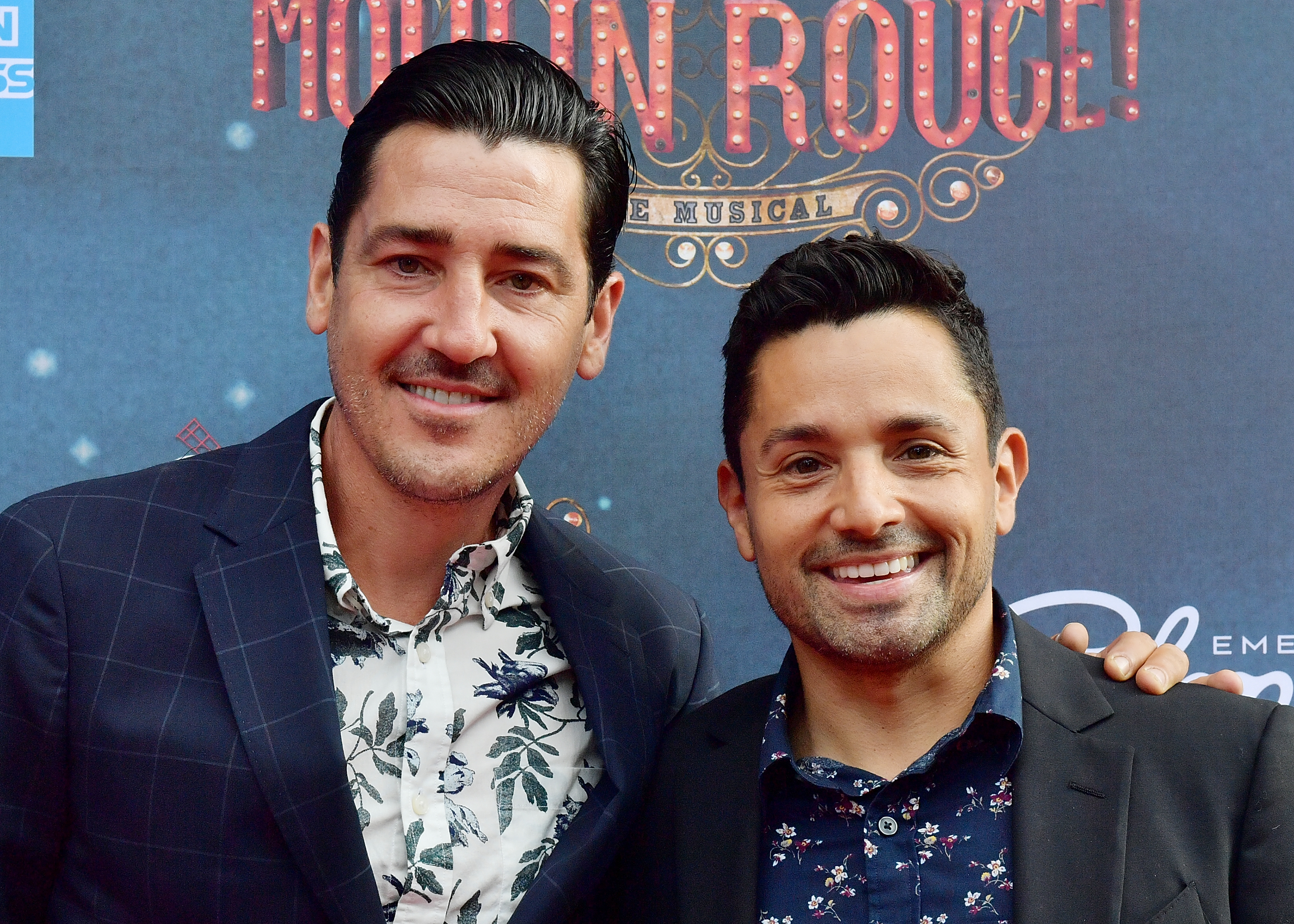 BOSTON, MA - JULY 29: Singer Jonathan Knight and Harley Rodriguez arrive at the grand re-opening of Boston