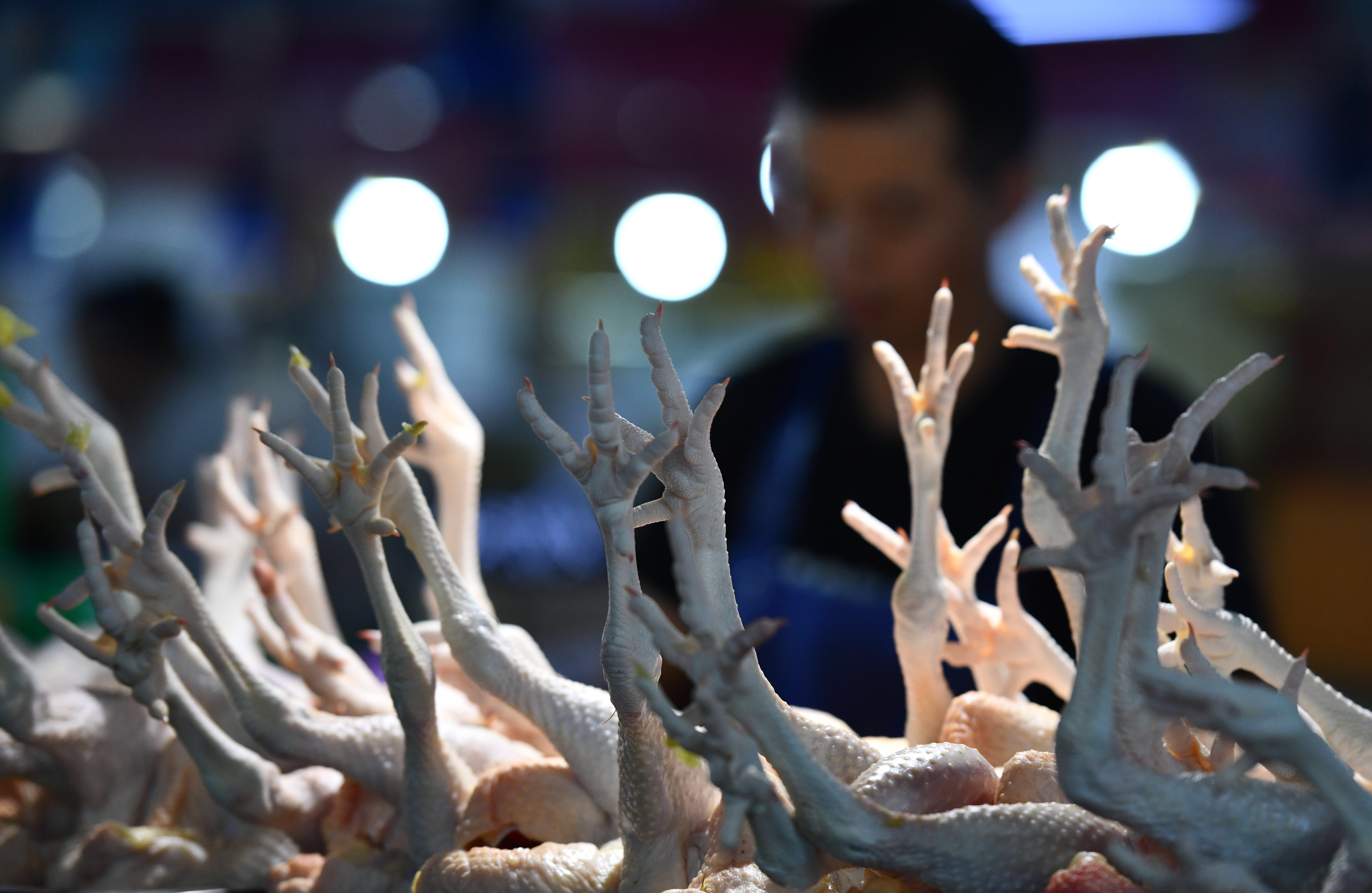 FUYANG, ANHUI, CHINA - 2023/08/09: Fresh chicken is being sold at a farmers