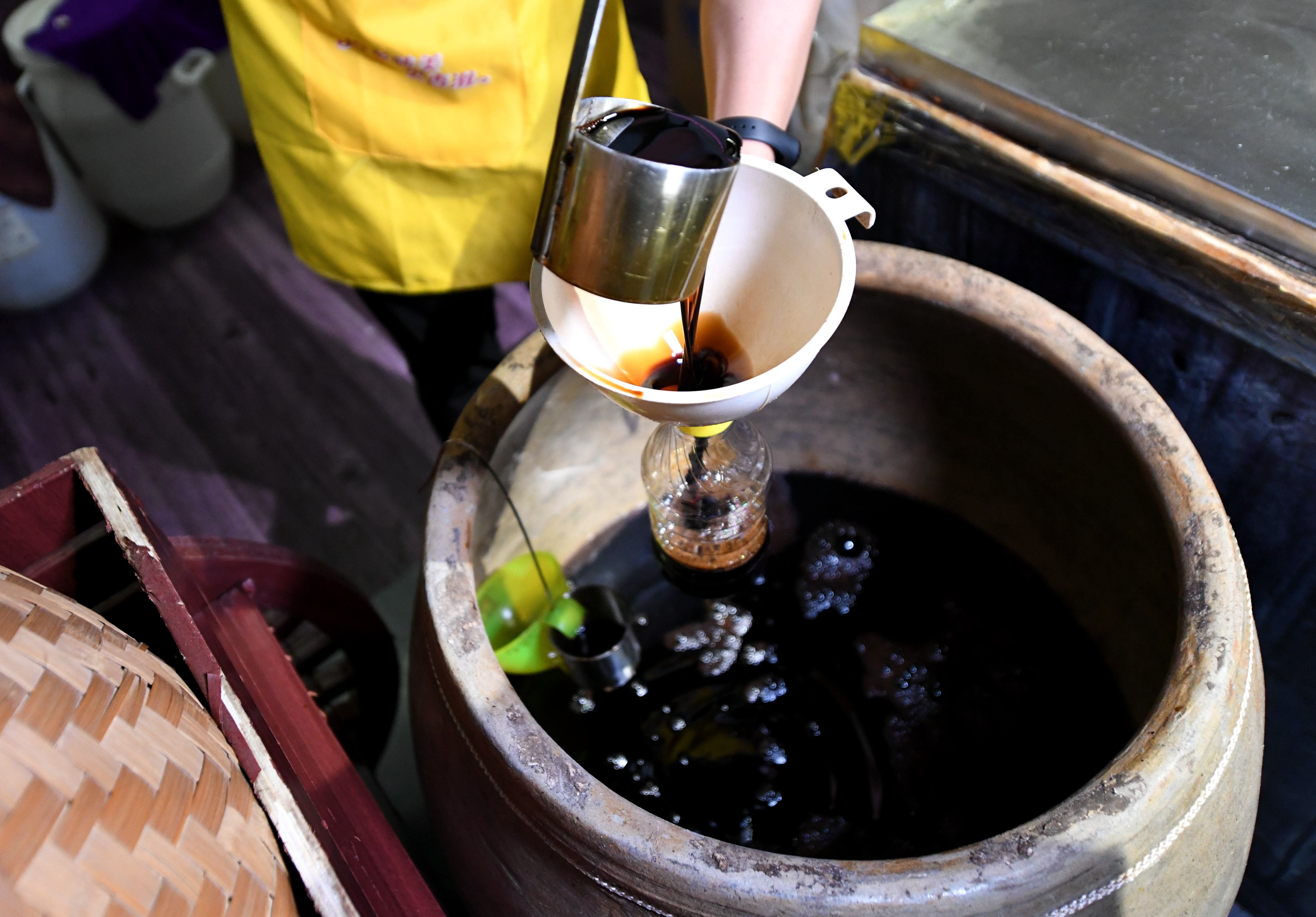 FUJIAN, CHINA - AUGUST 09: (CHINA MAINLAND OUT)The workers are brewing soy sauce with ancient skills on 09th August, 2020 in Xiamen,Fujian,China(Photo by TPG/Getty Images)