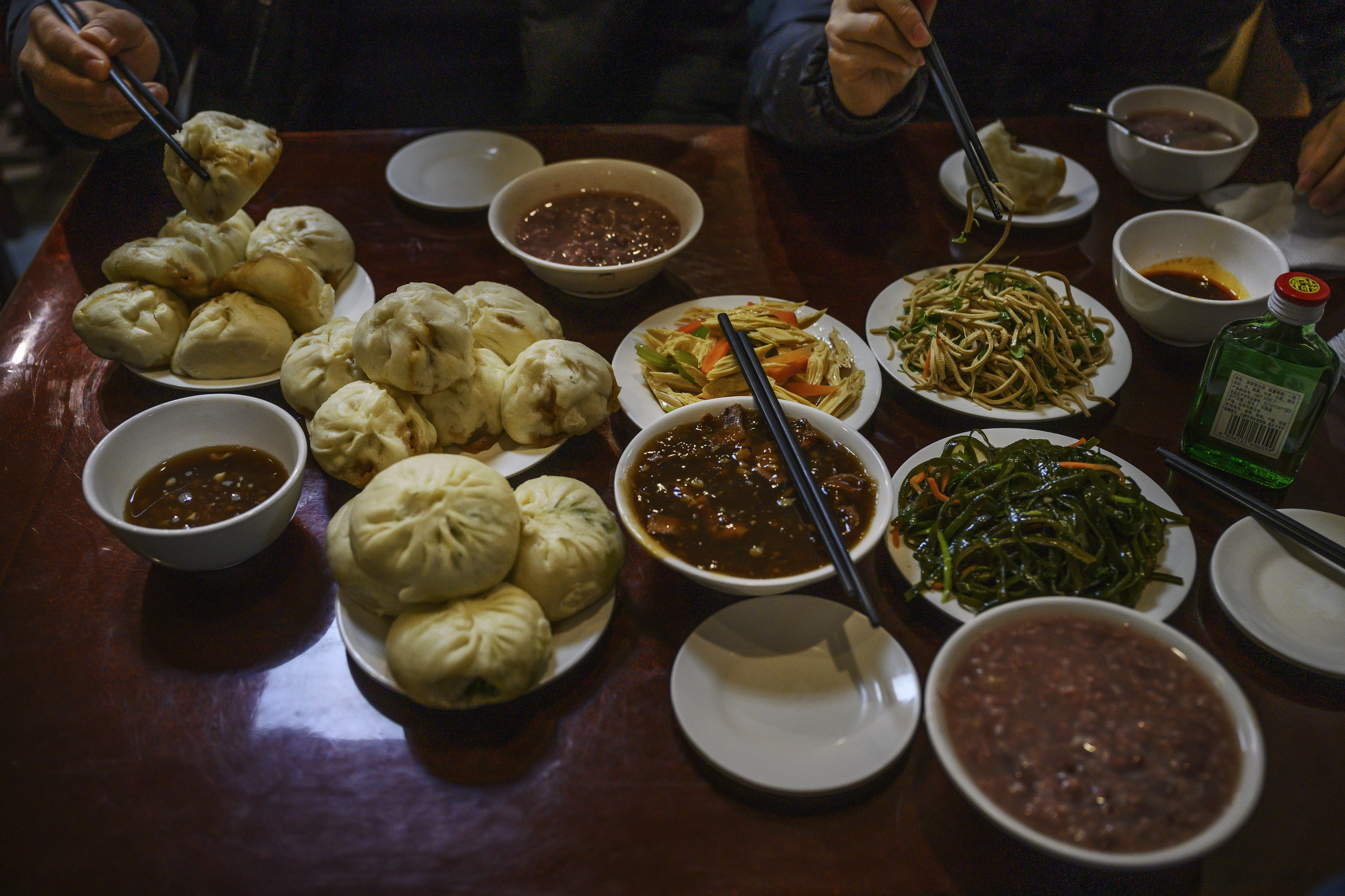 BEIJING, CHINA - NOVEMBER 09: Dishes of steamed buns and stew and other items are seen on the table at local restaurant Yaoji Chao Gan where then Vice President Joe Biden ate a meal in 2011 during a visit to China,  on November 9, 2020 in Beijing, China. The restaurants, famous for their steamed buns known as Baozi and a pork liver soup known as Chao Gan are often packed with hungry customers and the owner credits part of its popularity to Biden