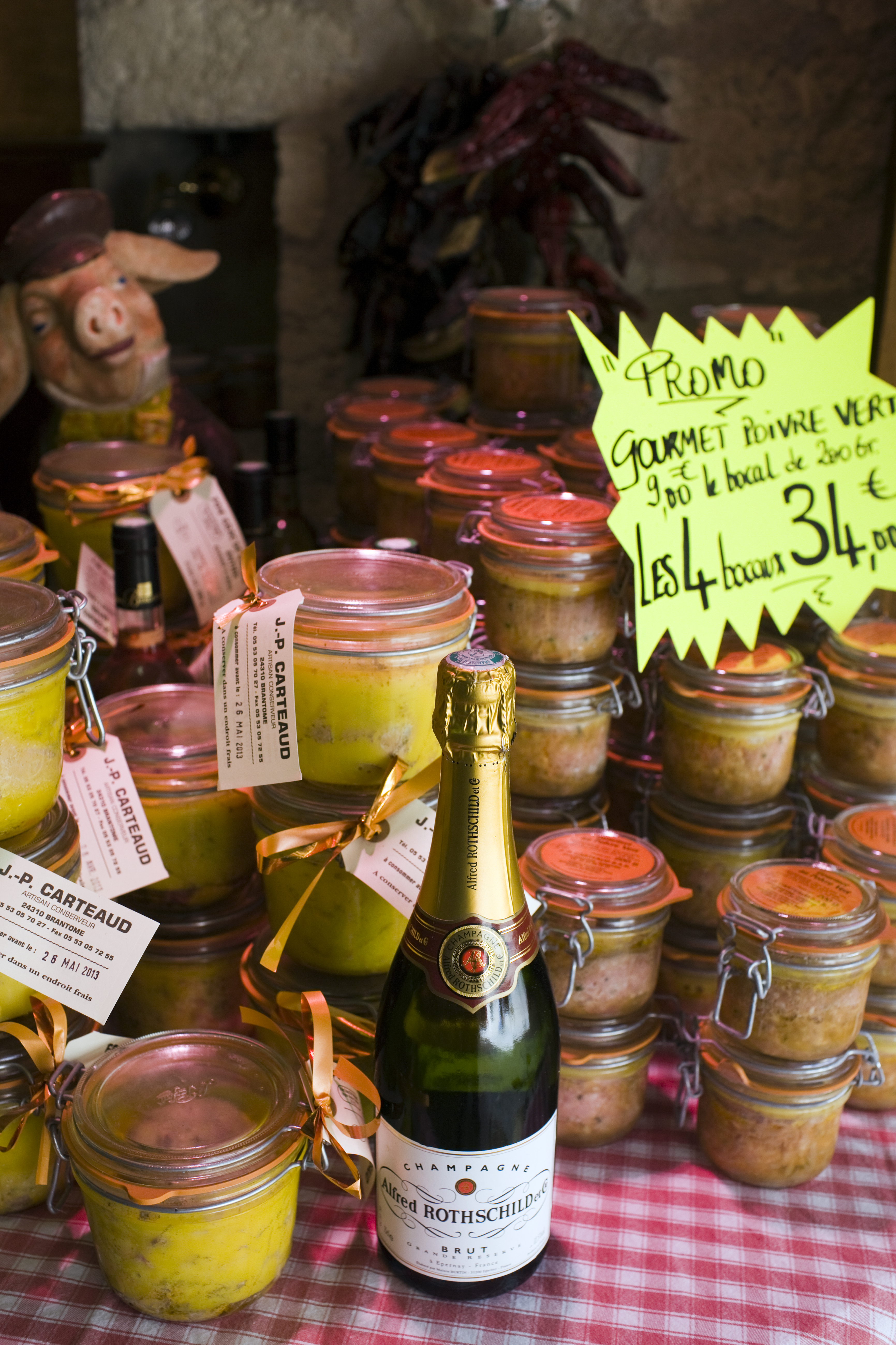 FRANCE - JULY 11:  Foie Gras potted meats and Alfred Rothschild Brut champagne on sale Brantome, North Dordogne, France  (Photo by Tim Graham/Getty Images)