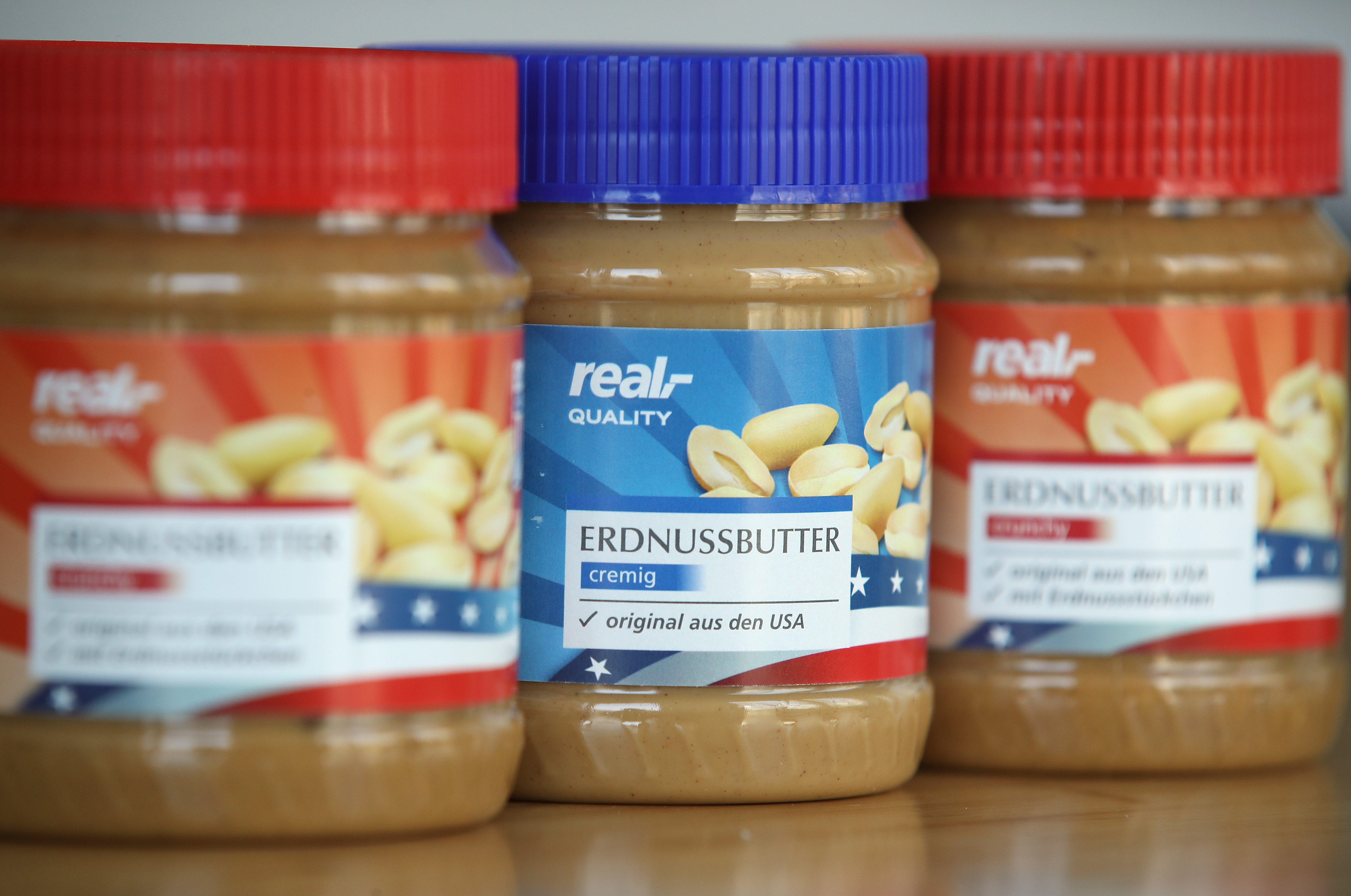 BERLIN, GERMANY - MARCH 08:  In this photo illustration jars of American peanut butter bought at a German supermakret stand arranged on March 8, 2018 in Berlin, Germany. U.S. President Donald Trump has promised to authorize tariffs on imported steel and aluminum today and the European Commission has vowed to retaliate with tariffs on Levi