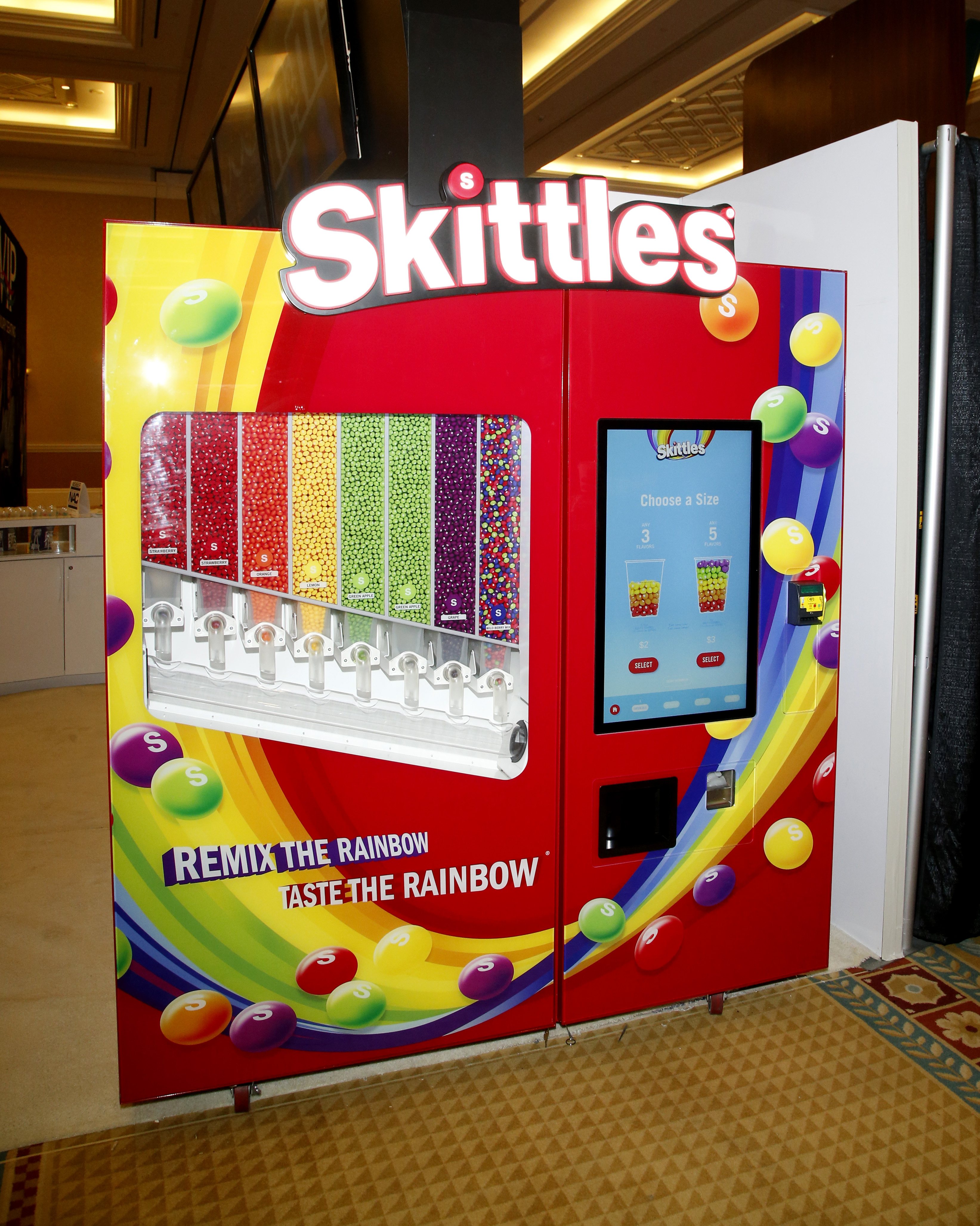 LAS VEGAS, NEVADA - AUGUST 26:  An automated Skittles vending machine is displayed in the CinemaCon 2021 Trade Show at Caesars Palace during CinemaCon, the official convention of the National Association of Theatre Owners, on August 26, 2021 in Las Vegas, Nevada. (Photo by Gabe Ginsberg/Getty Images)