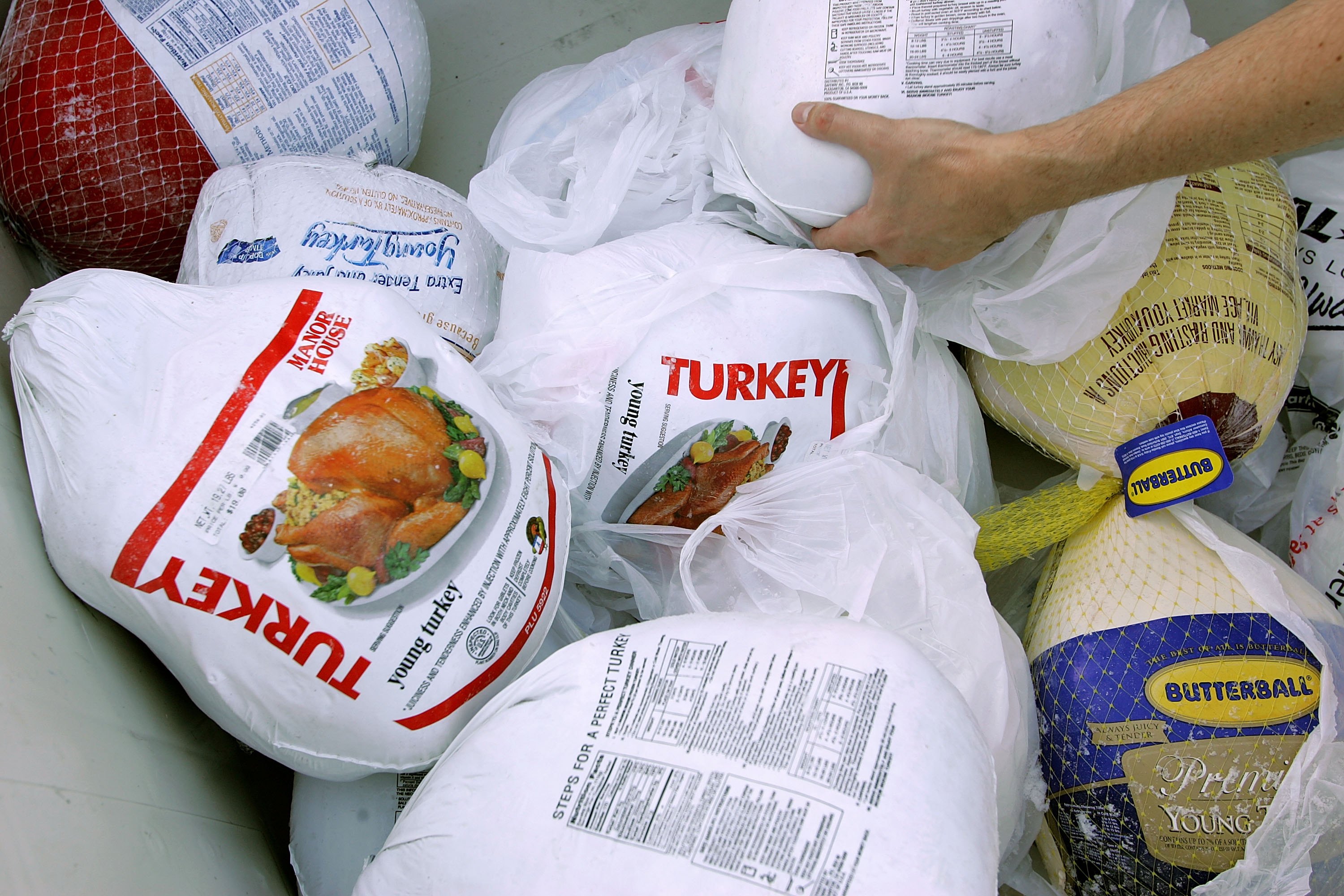 SAN FRANCISCO - NOVEMBER 21:  A volunteer prepares a box of turkeys to be given out during the 2006 holiday turkey distribution at the San Francisco Food Bank November 21, 2006 in San Francisco, California. Despite donations being down at most food banks across the country, the San Francisco Food Bank will distribute over 1,500 turkeys to churches and community centers over the holiday season.  (Photo by Justin Sullivan/Getty Images)