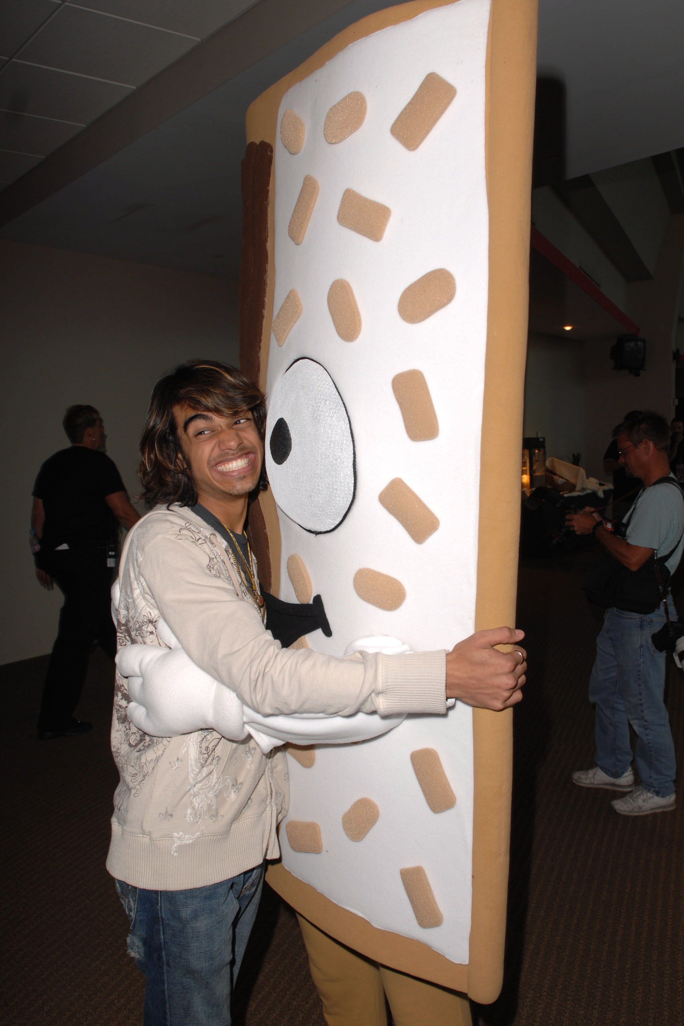 SUNRISE, FL - JULY 6:  American Idol Sanjaya Malakar hugs the Poptart mascot prior to the concert at The Bank Atlantic Center on opening night of the 2007 tour, on July 6, 2007, in Sunrise Florida. (Photo By Larry Marano/Getty Images)