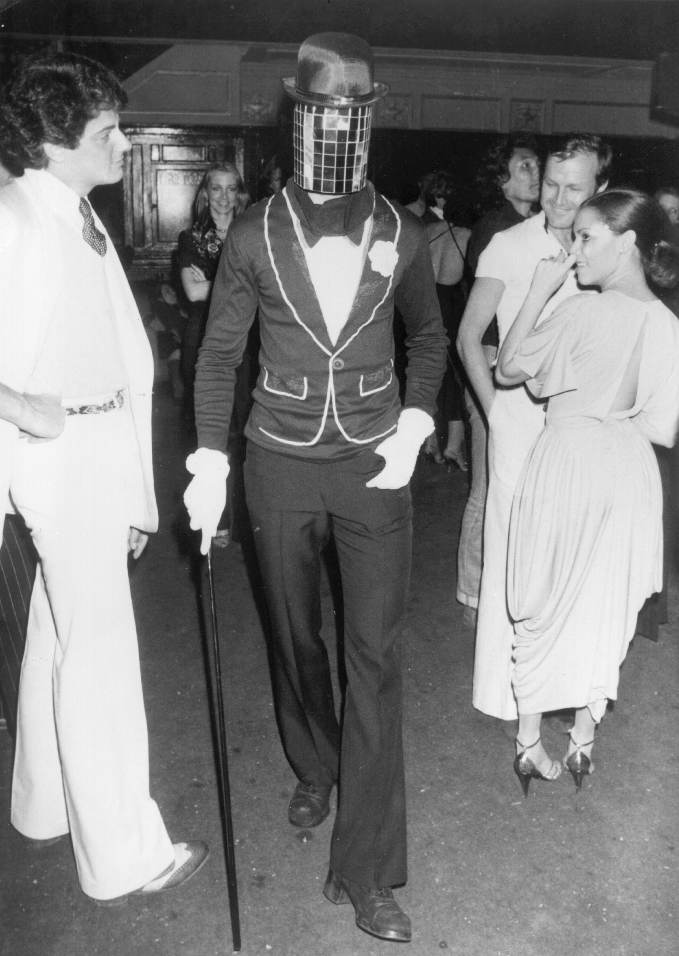 February 1979:  A man in costume with a mirror mask at New York