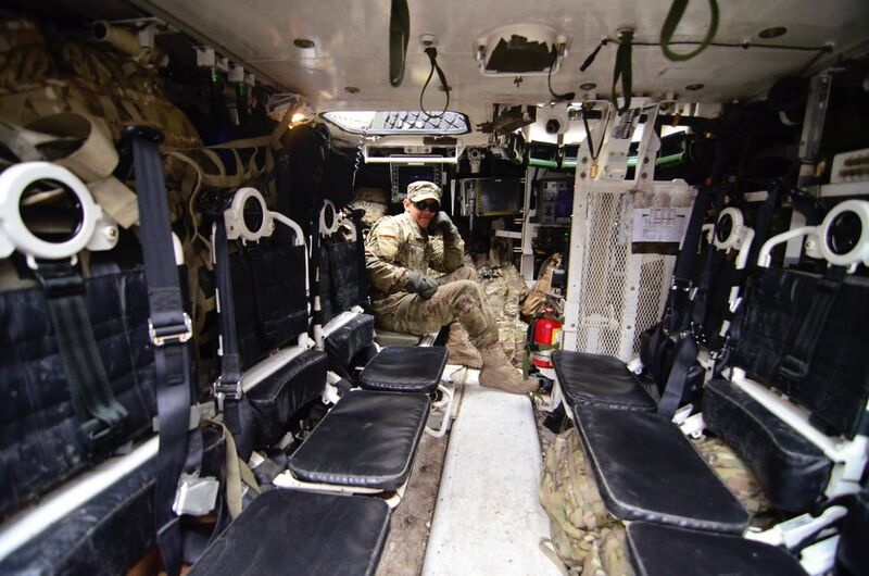 Man in Soldier Suit Sitting in Black Leather Seat