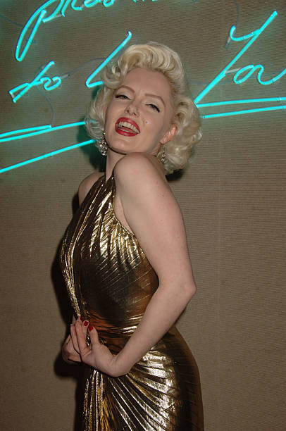 LONDON - MARCH 10: (EMBARGOED FOR PUBLICATION IN UK TABLOID NEWSPAPERS UNTIL 48 HOURS AFTER CREATE DATE AND TIME) Suzie Kennedy as Marilyn Monroe at the The Lighthouse Gala Auction in aid of the Terrence Higgins Trust held at Christie