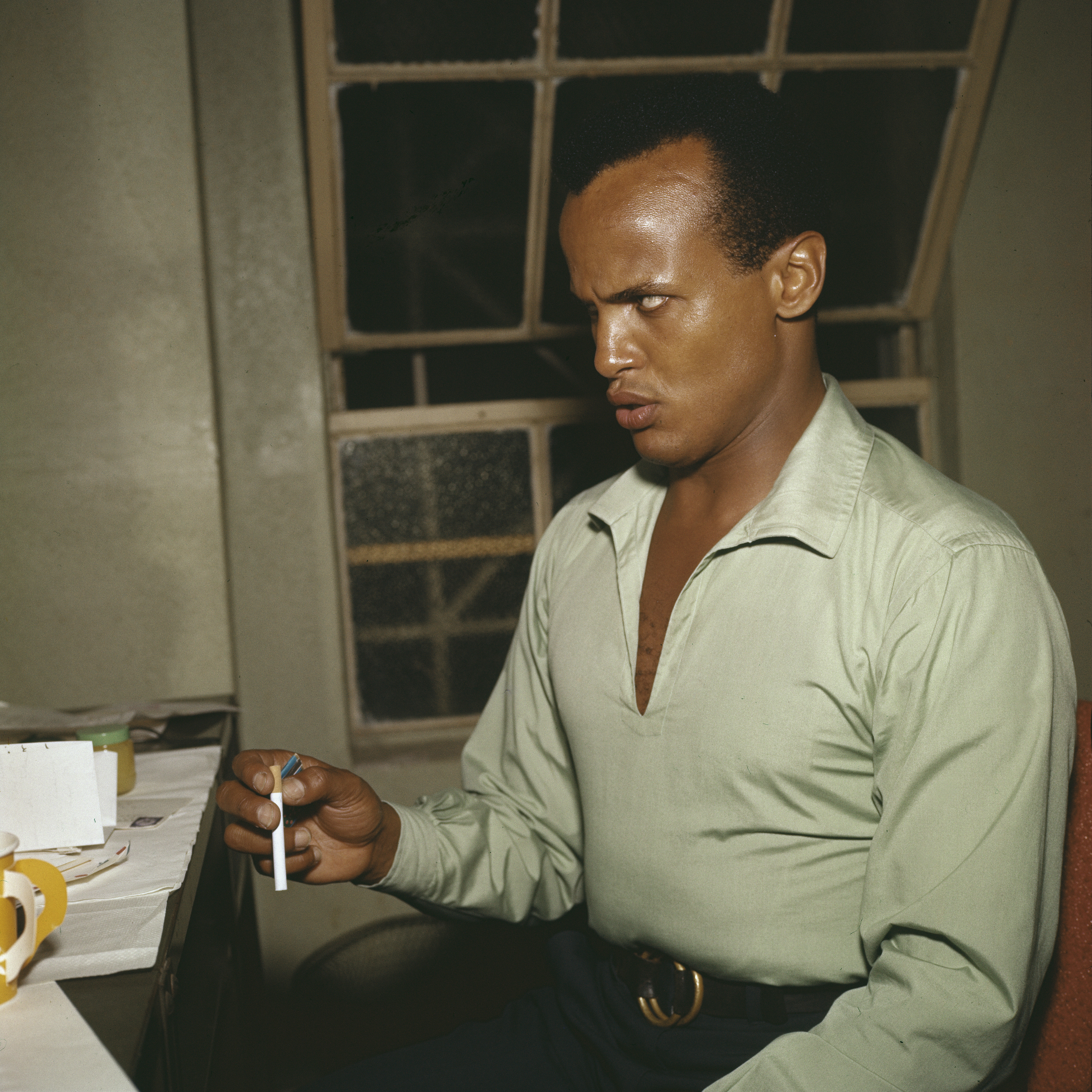 Harry Belafonte, posed, backstage, 1957. (Photo by Harry Hammond/V&A Images/Getty Images)