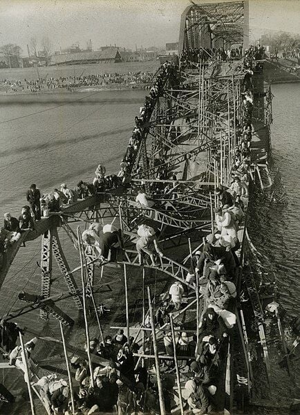 File:Flight of Refugees Across Wrecked Bridge in Korea.jpg