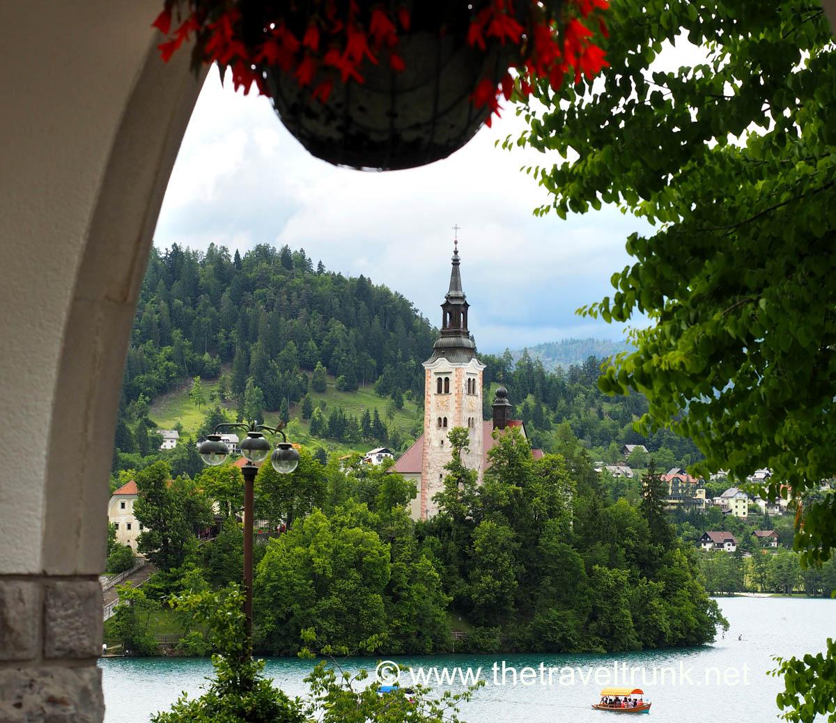 The island and Church of the Assumption of Maria in the middle of Lake Bled as viewed from the former residence of President Tito.
