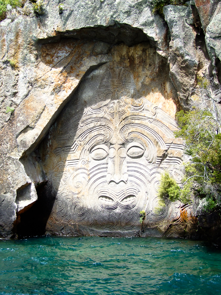 Māori rock carvings at Mine Bay on Lake Taupō are over 10 metres high and accessible only by boat or kayak. Photo credit