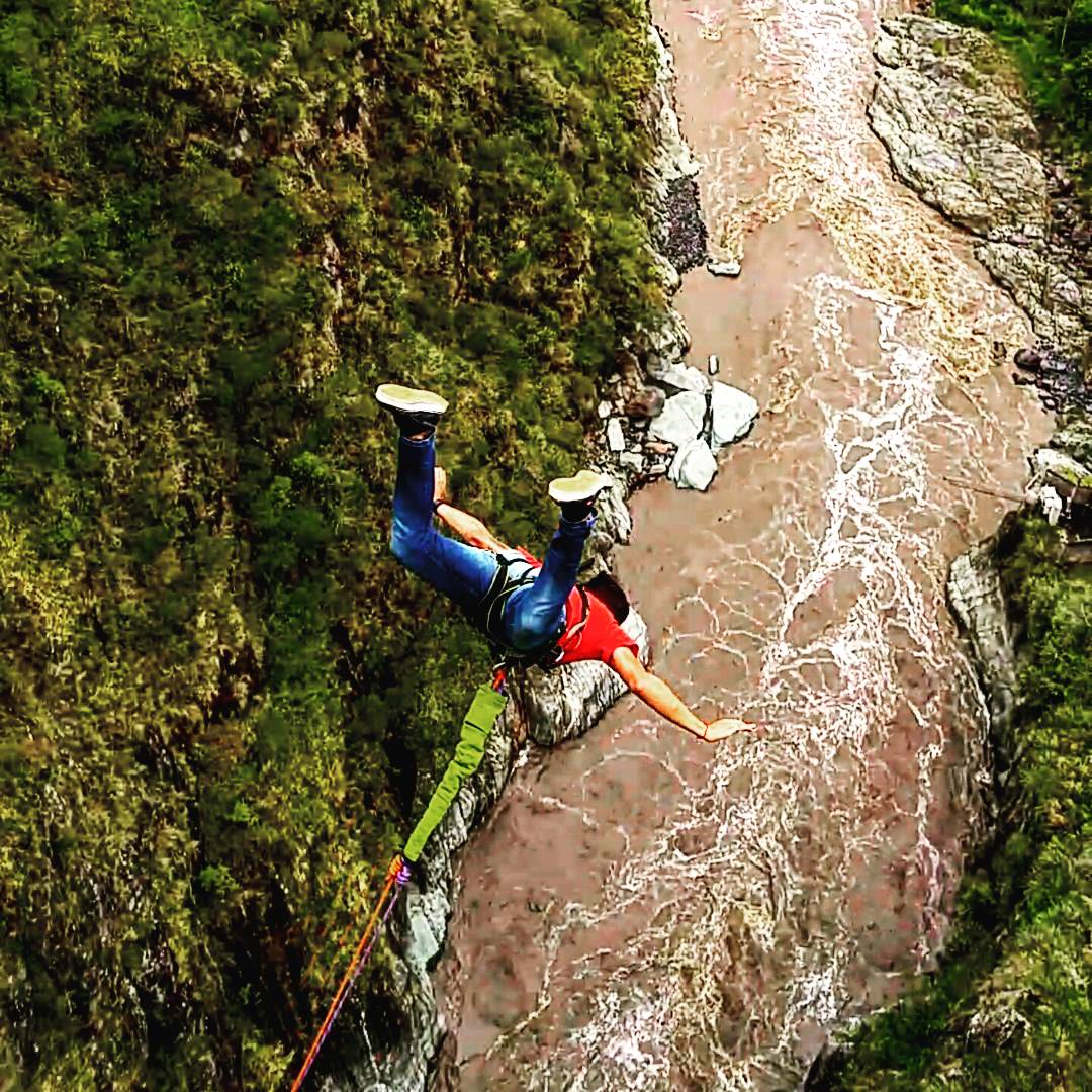 Jumping off a bridge. Baños, Ecuador. Photo credit