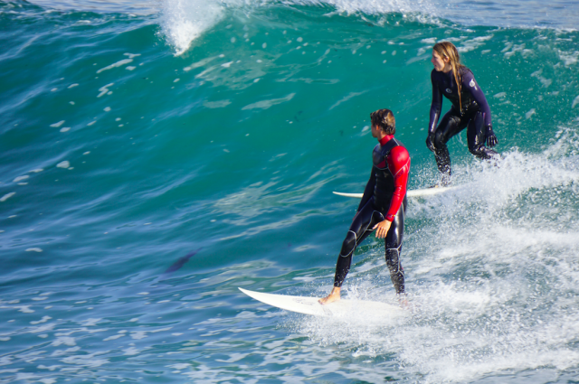 The number one rule of surfing is to not “drop-in” on other surfers like this woman is.