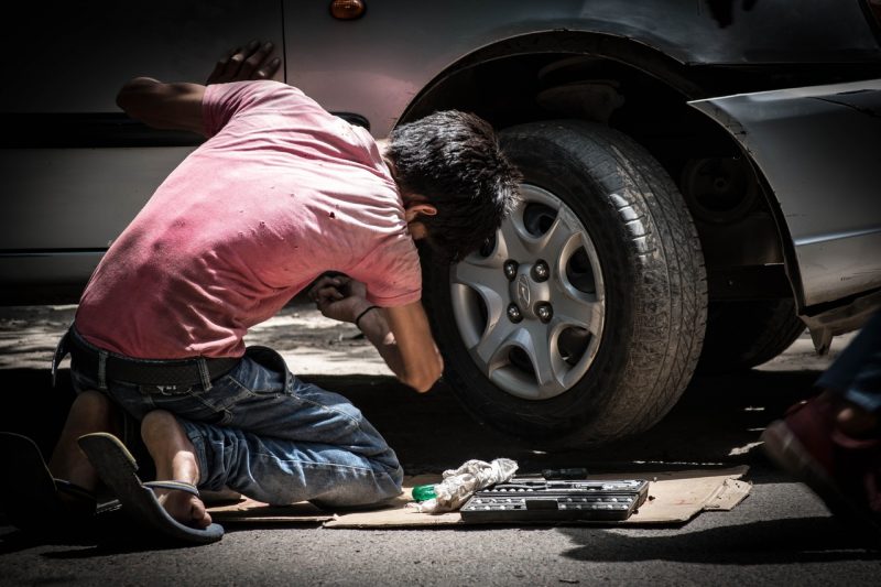 Fixing the tires on a car