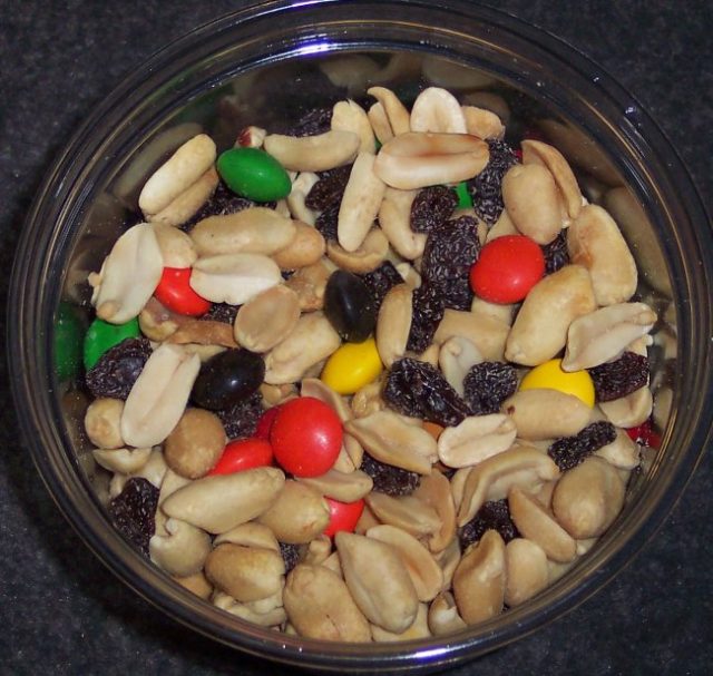 Trail mix made from peanuts, raisins, and candy coated chocolate, around 4.8 kcal/gram – Author: ImGz – CC BY-SA 3.0