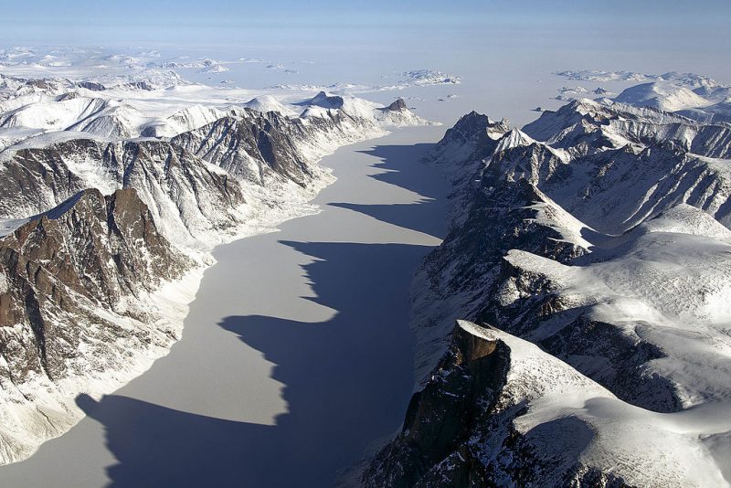 An ice-covered fjord on Baffin Island, with Davis Strait in the background