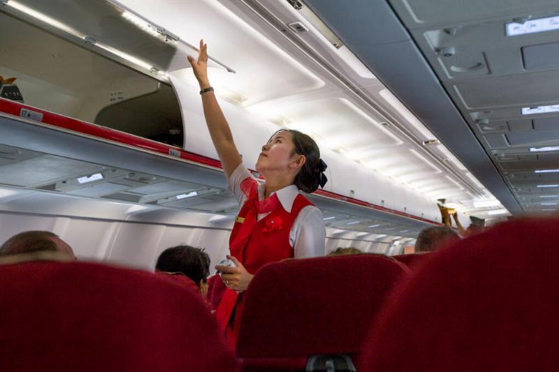 Flight attendant inside an air Koryo tupolev plane, Pyongan Province, Pyongyang, North Korea