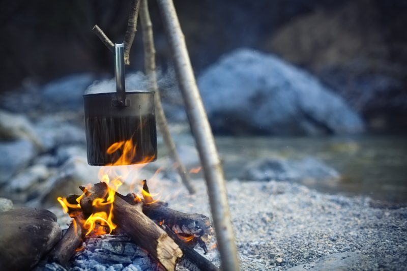 A simple pot over a fire can mean hot food, which can be the difference between life and death.