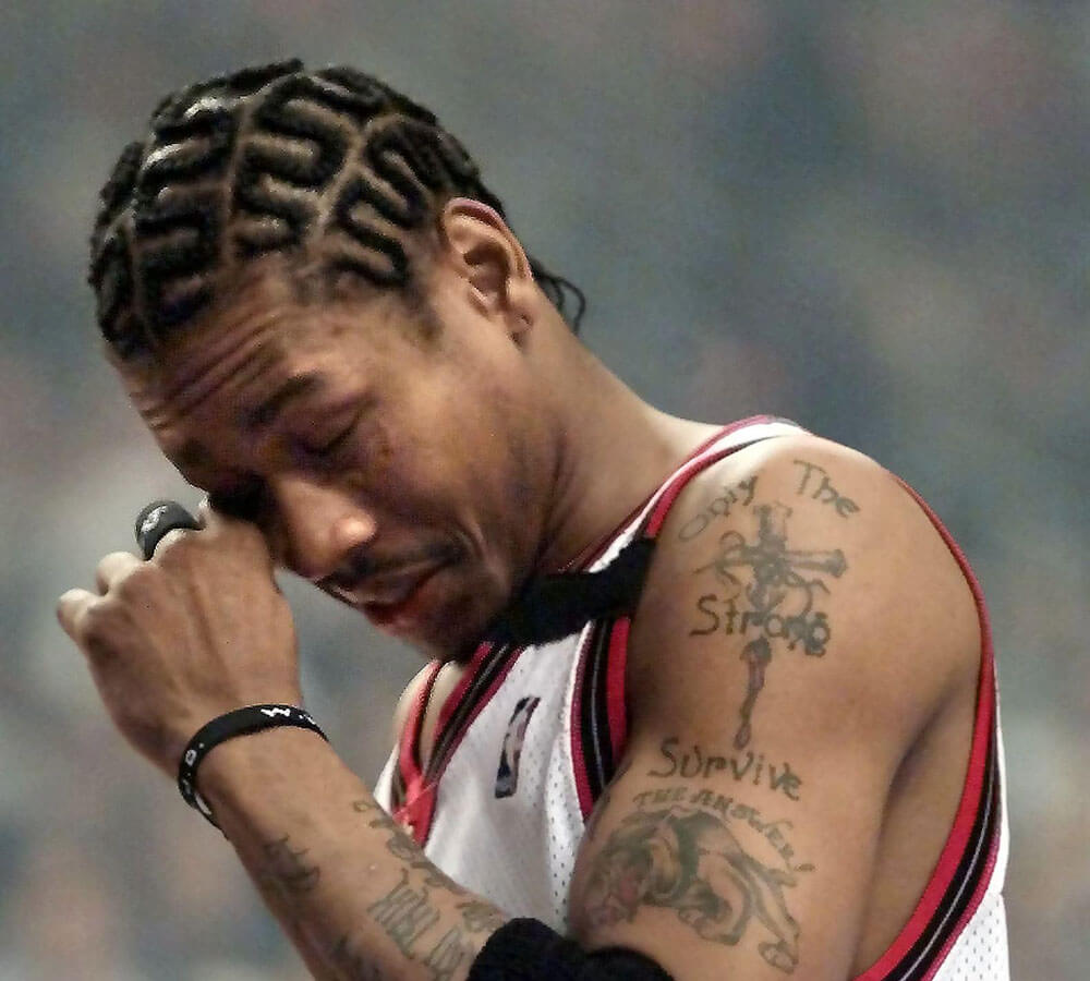 Philadelphia 76ers' guard Allen Iverson rubs his e
