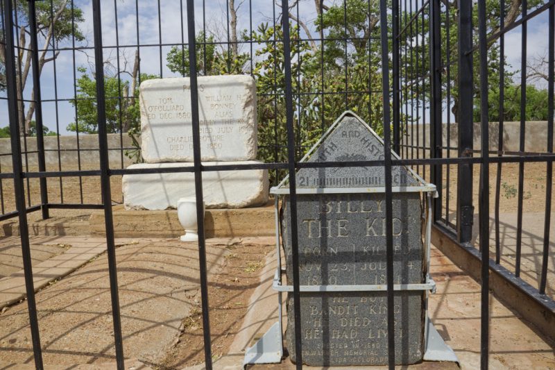 Fort Sumner, New Mexico, United States – June 4, 2012. William H. Bonney aka Billy the Kid’s grave in Old Fort Sumner post cemetery in New Mexico. A prominent figure in the American Wild West, he captured notoriety as an outlaw in 1881 when a bounty was placed on his head.