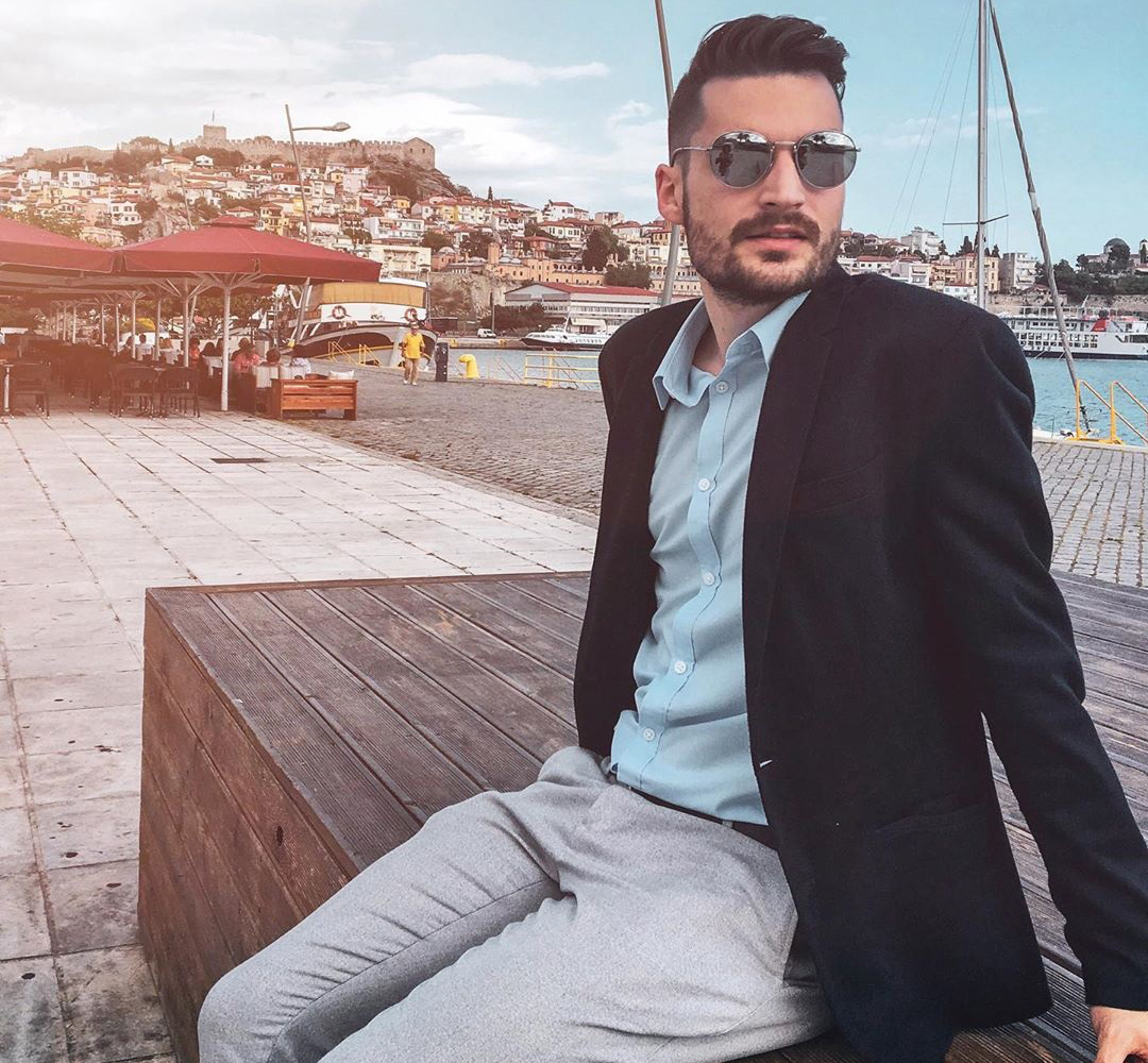 This person is wearing a suit, something that has become more rare 