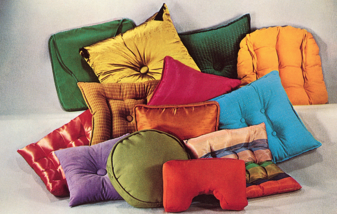 assortment of multi-colored throw pillows.