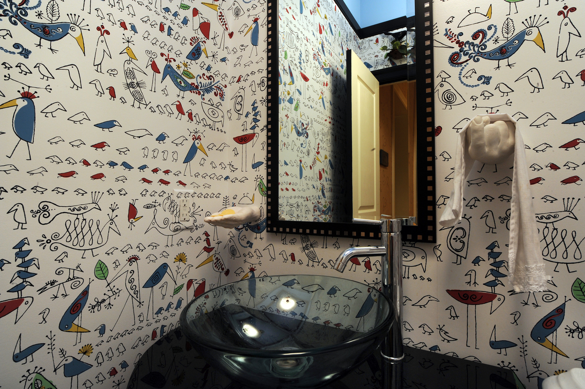 This wallpaper pattern is called Aviary by Schumacher and is used in a hall bath