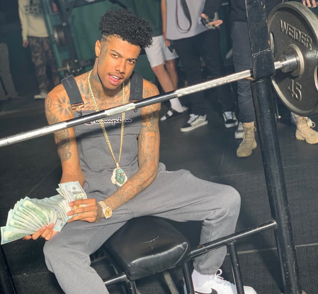 Blueface holding a lot of money 