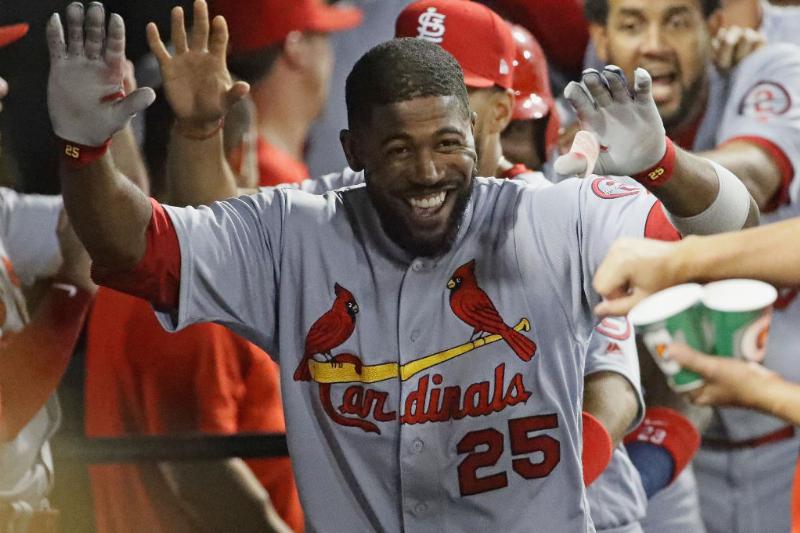 Dexter Fowler #25 of the St. Louis Cardinals celebrates in the dugout after hitting a grand slam home run in the 6th inning against the Chicago White Sox at Guaranteed Rate Field on July 10-995773460