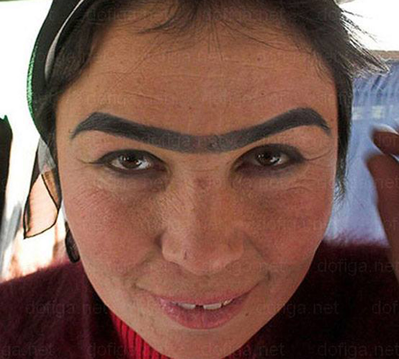 a woman with a unibrow