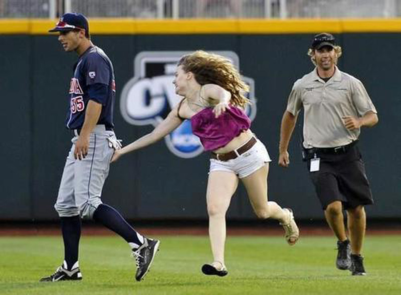 a female fan ran onto the field to grab players' butts