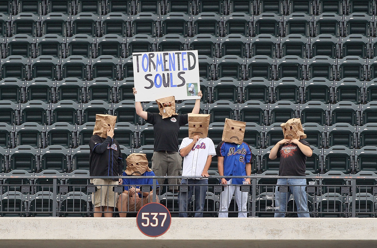 Fans of the New York Mets sit alone in the upper deck during the game against the Cincinnati Reds at Citi Field on September 28, 2011 in the Flushing neighborhood of the Queens borough of New York City.