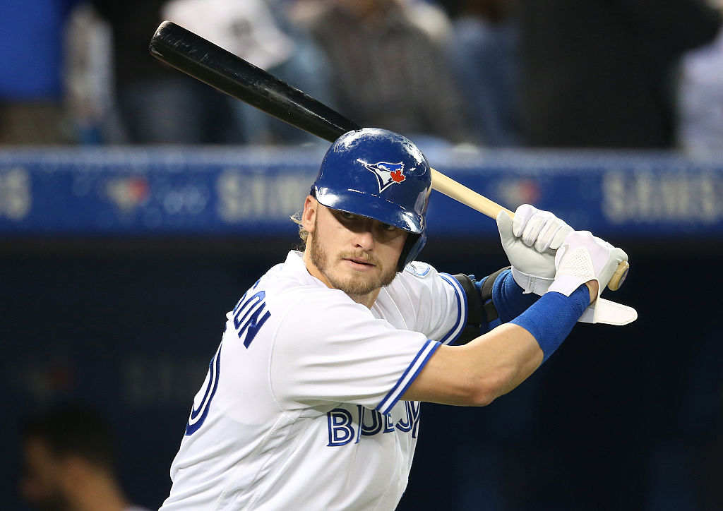 Josh Donaldson #20 of the Toronto Blue Jays takes a practice swing left-handed from the on-deck circle before batting