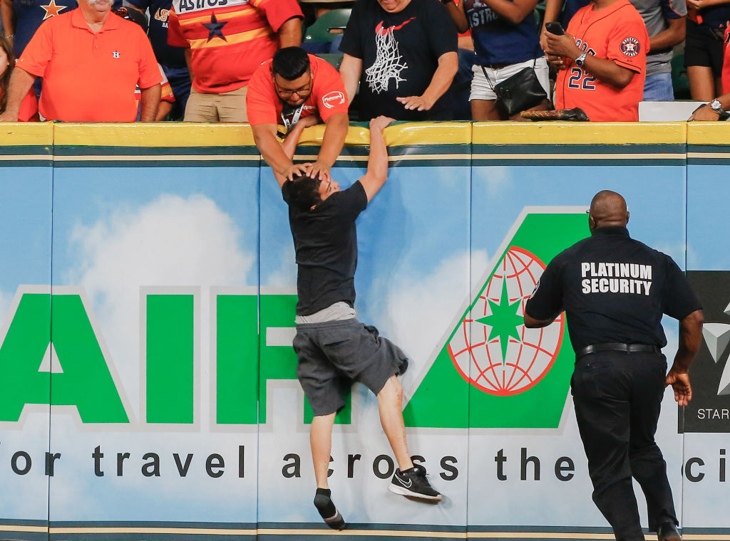 Man pushing someone's face 