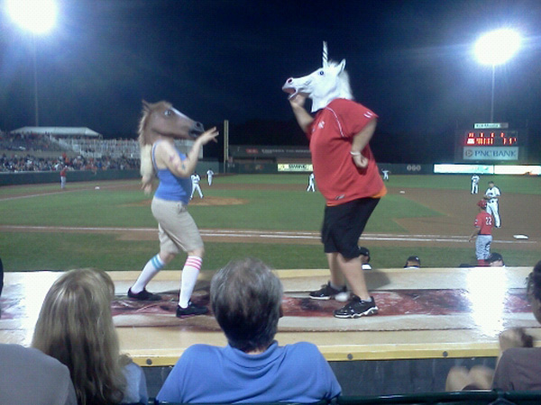 two people dancing on the dugout