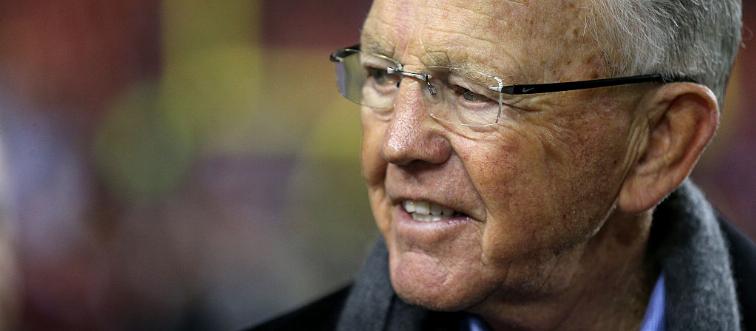 In 1990, Joe Gibbs was the head coach of which team?