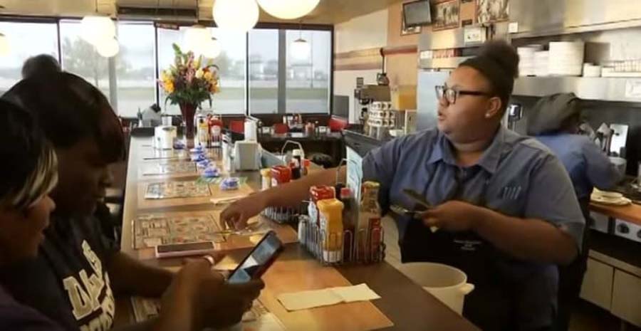 a busy waitress behind the counter